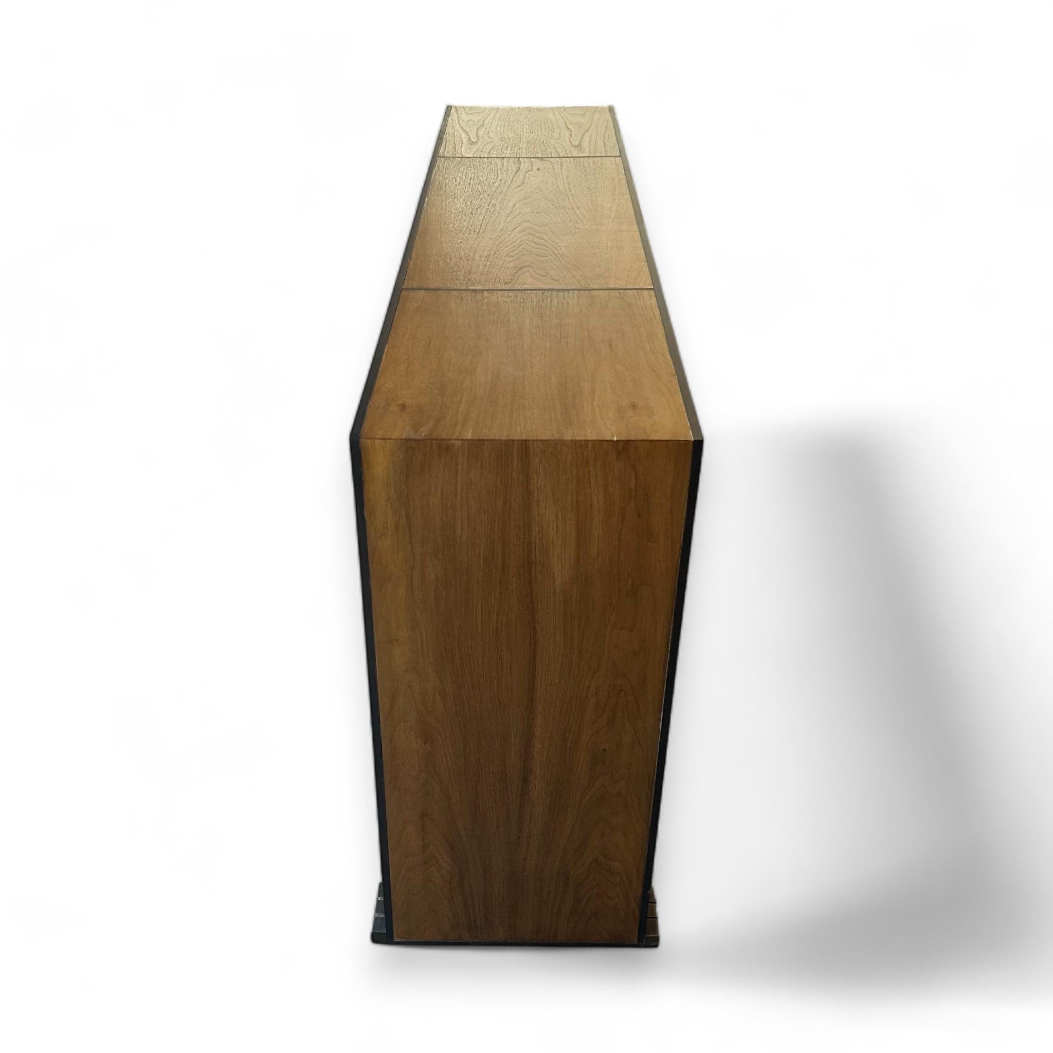 Jean De Merry Axel Console size Small in Oak with Bronze Frame with Bronze Accents and Inlays.
Small / W54″ x D13″ x H29.5″

Check our storefront for Jean De Merry Axel Console Large in Parchment.

Jean de Merry is a luxury furniture line of