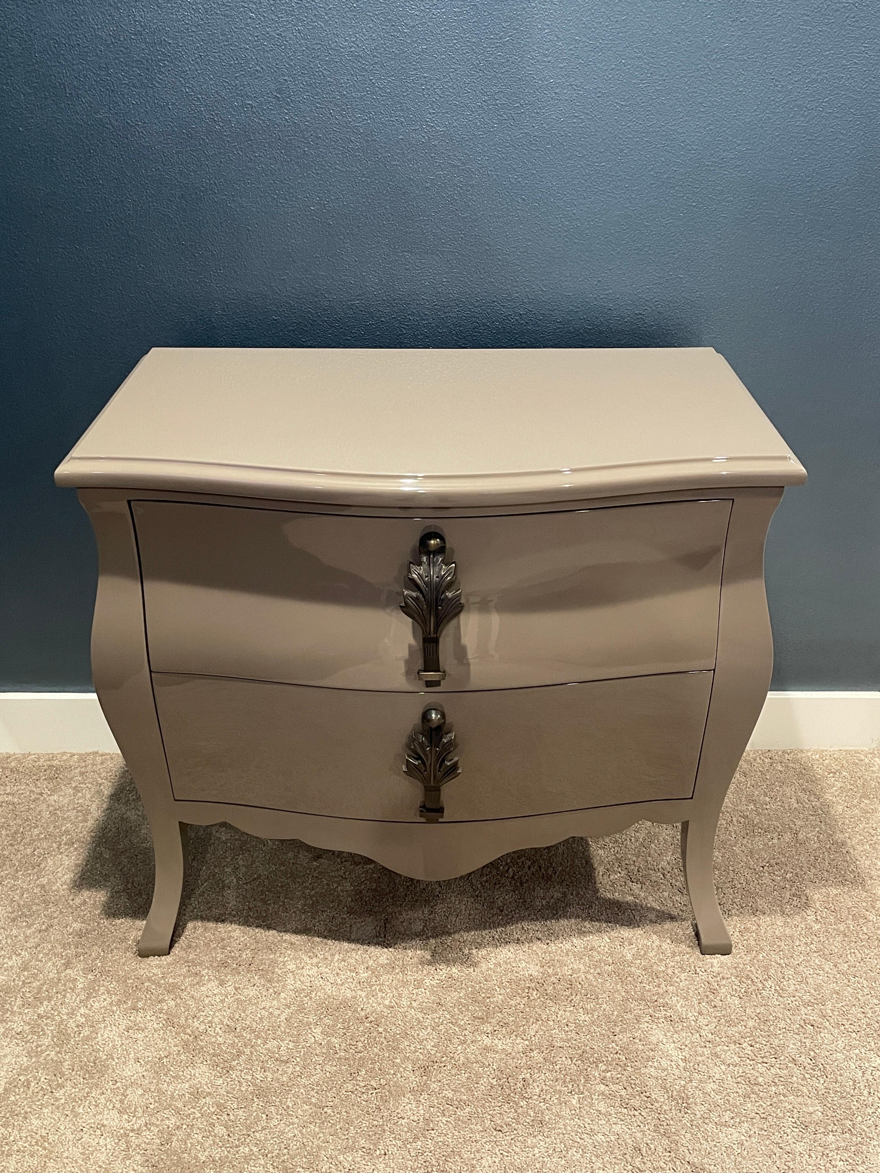 This gorgeous paid of vintage inspired French lacquer side tables in finished in hand-laid Inca Grey French lacquer with Rodin Patina solid bronze pulls.  These pieces were produced less than a year ago and stored in Jean de Merry's LA warehouse. 