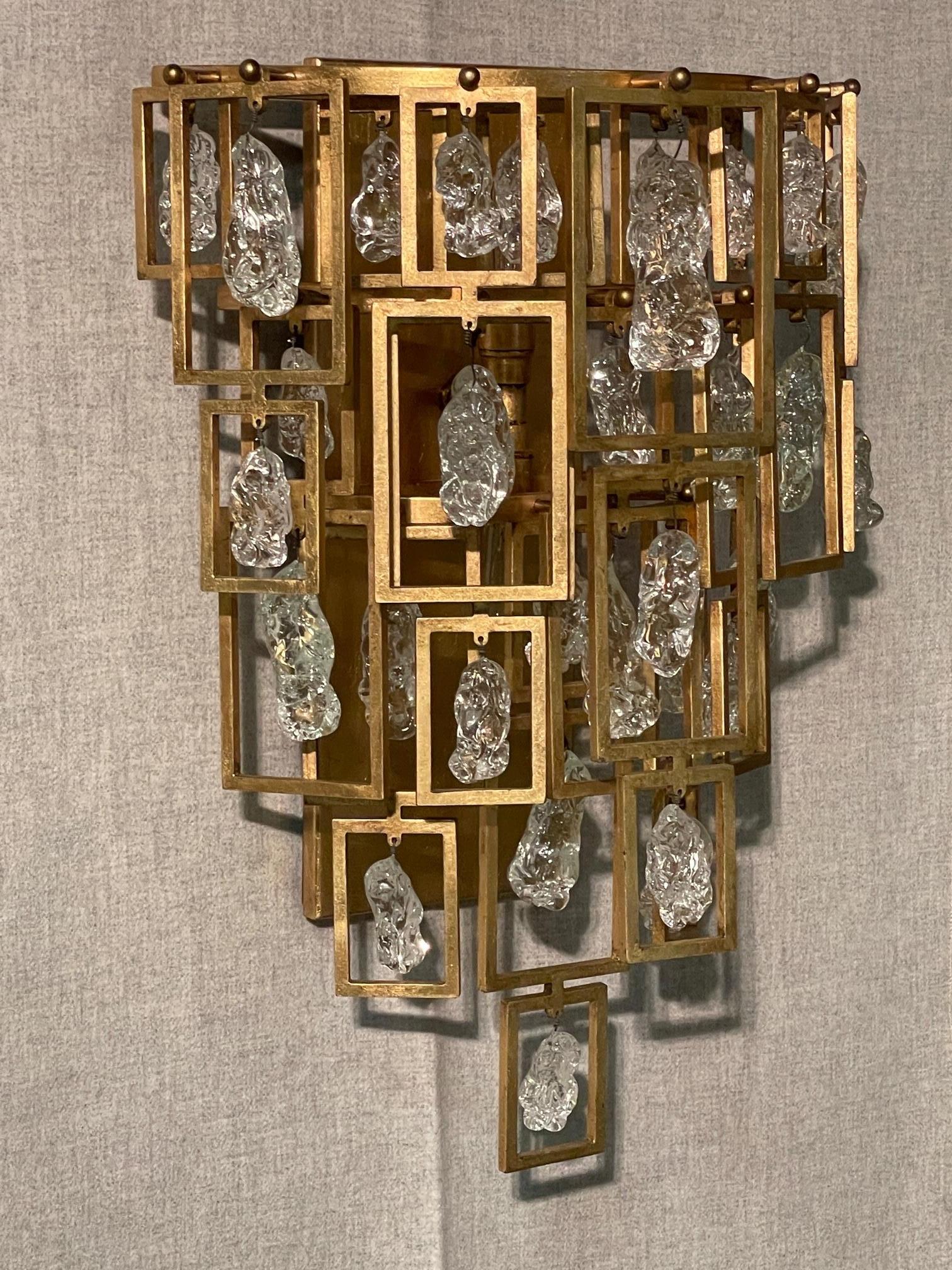 Jean de Merry collaborated with renown interior designer Kara Mann with a custom design aptly named the Kara Chandelier.  It's success spawned this accompanying set of wall sconces.  The design is elegant and decadent beyond words.  Their diverse