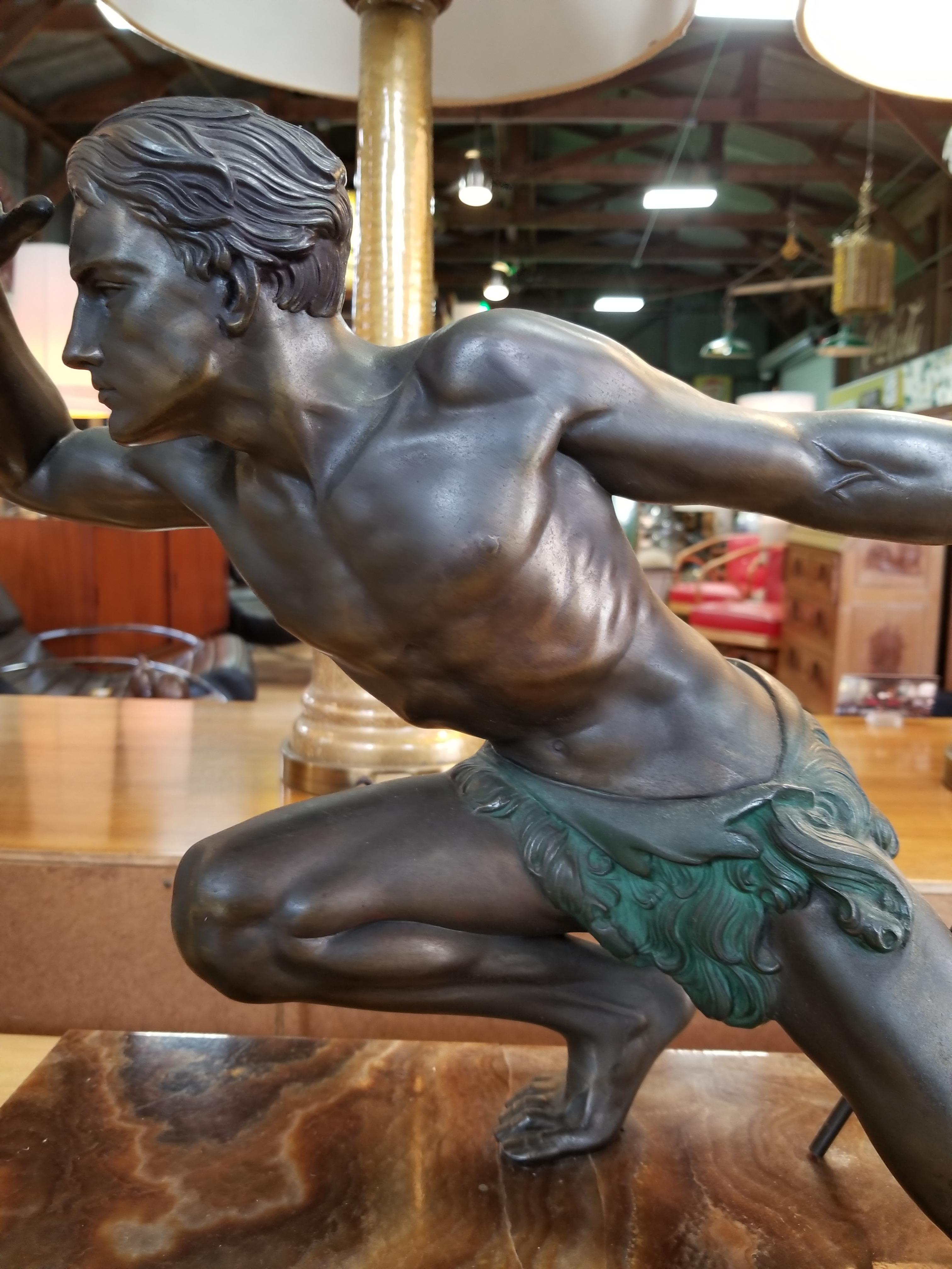 Art Deco spelter sculpture of a hunter with spear by Jean de Roncourt. French, Circa. 1930. Mounted to stone marble base with beautiful grain. Signed on base. very good original condition. Height to top of head measures 15