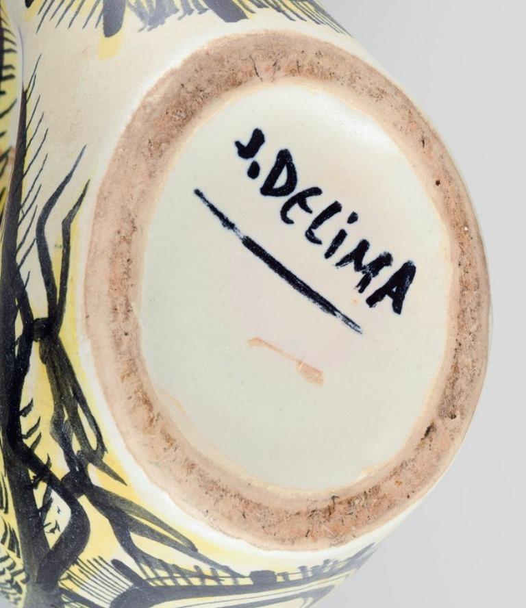 Mid-20th Century Jean Delima for Keraluc, Quimper, France, a pair of large faience pitchers.