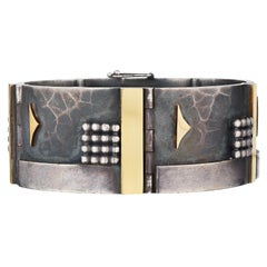 Bracciale Modernista Jean Despres in argento sterling e oro giallo 18 carati
