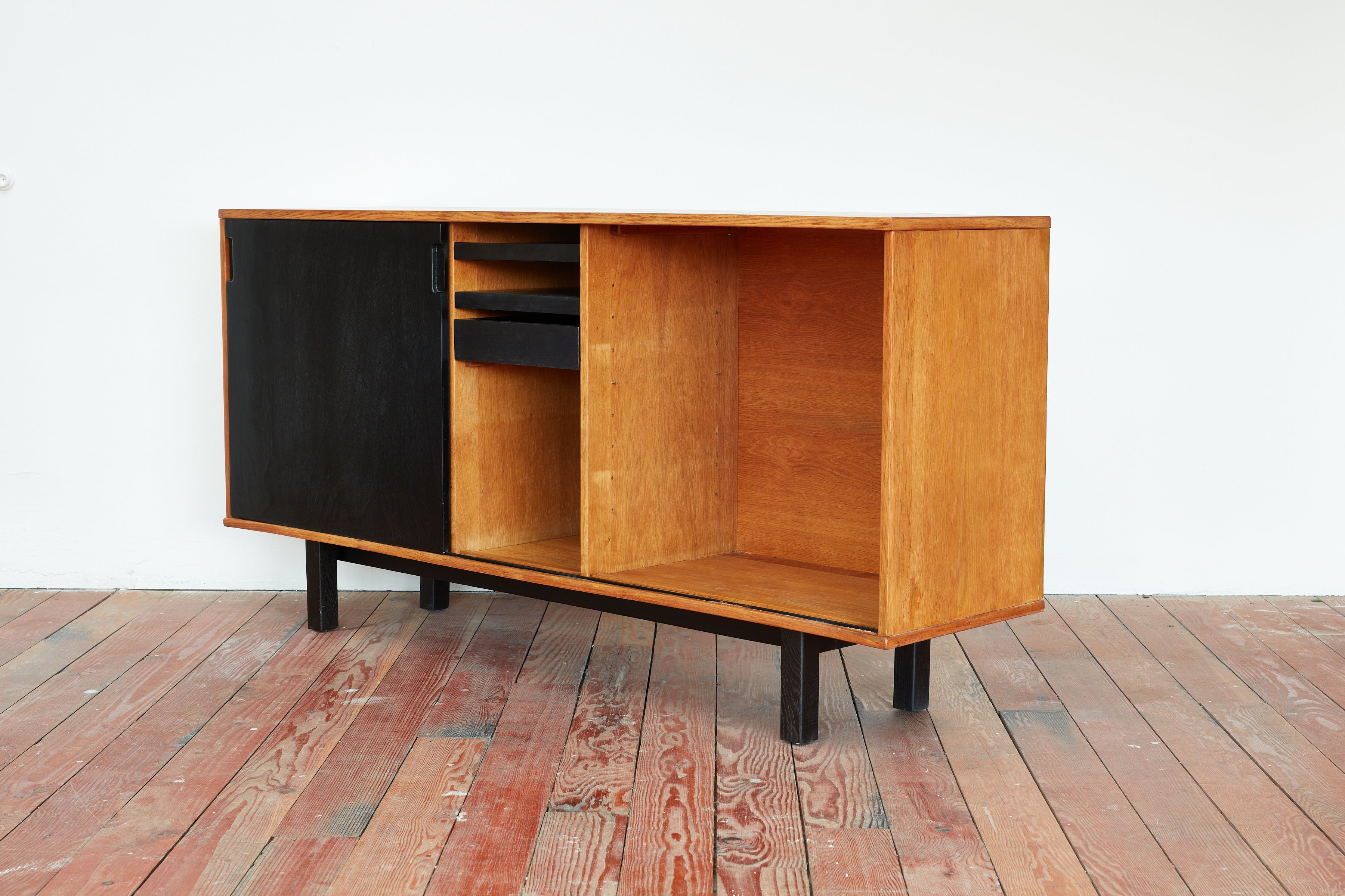 Oak and black sideboard by Jean Domps, circa 1950s. 
Created for the 