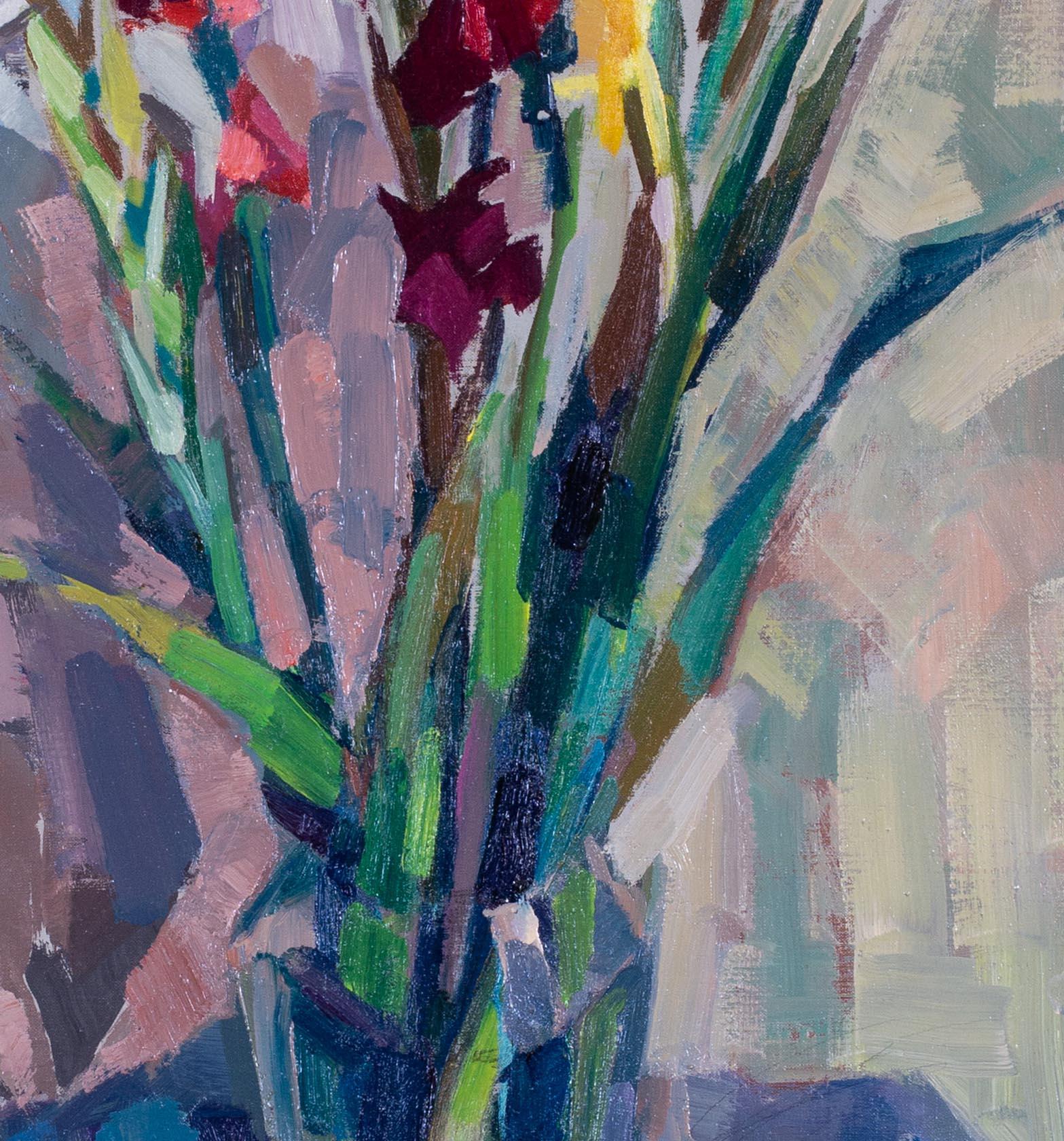 This stunning original Post-Impressionist oil painting features a vibrant vase of red, white and yellow gladioli. The bold, broad brushstrokes contribute to the excitement of the piece, while the juxtaposition of strong red and yellow tones creates