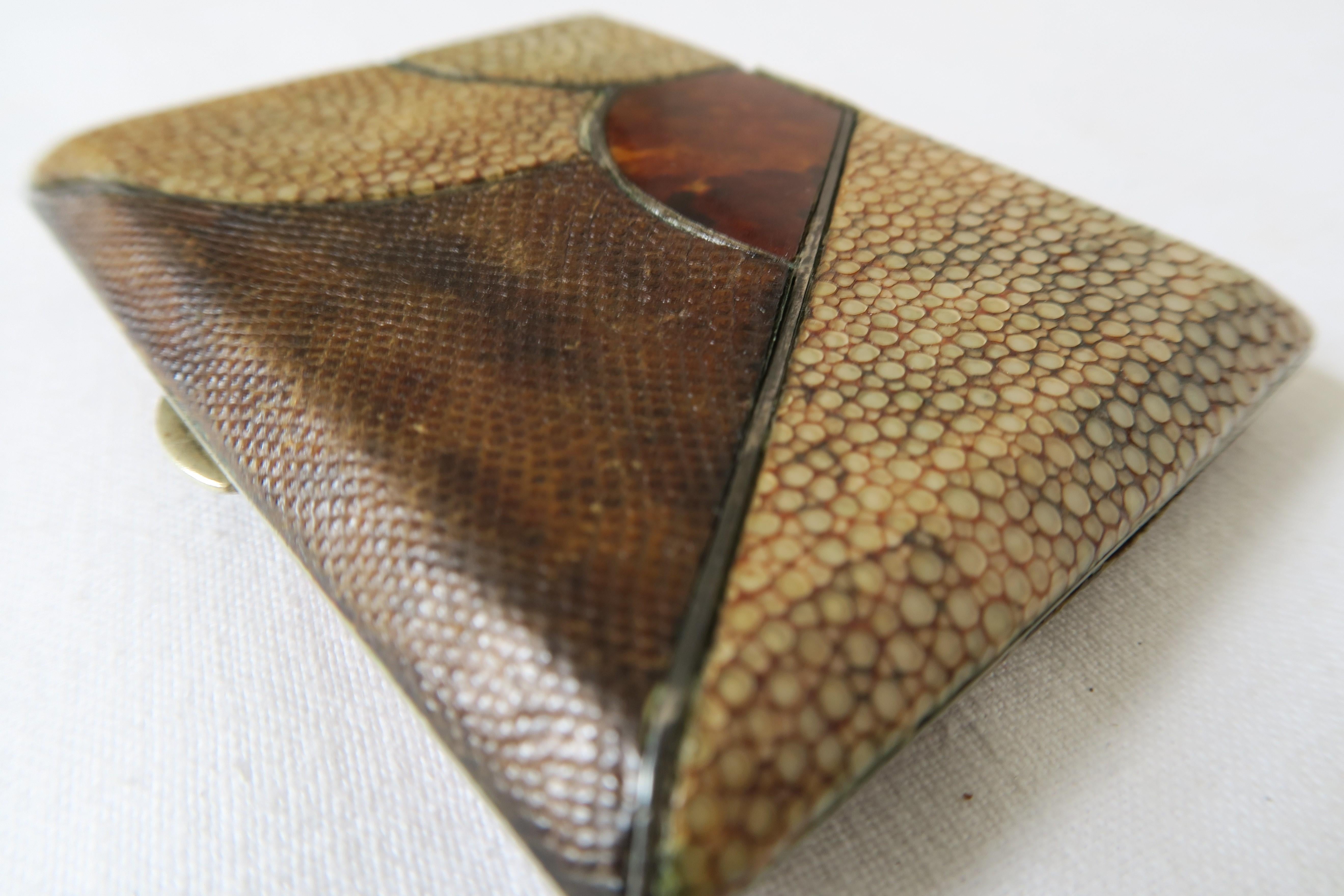 For sale is a slim cigarette box by French creator Jean Dunand. It was hand crafted from gold-plated sterling silver in the interior and different kinds of leather on the exterior. 

The abject is in excellent condition. Neither altered nor