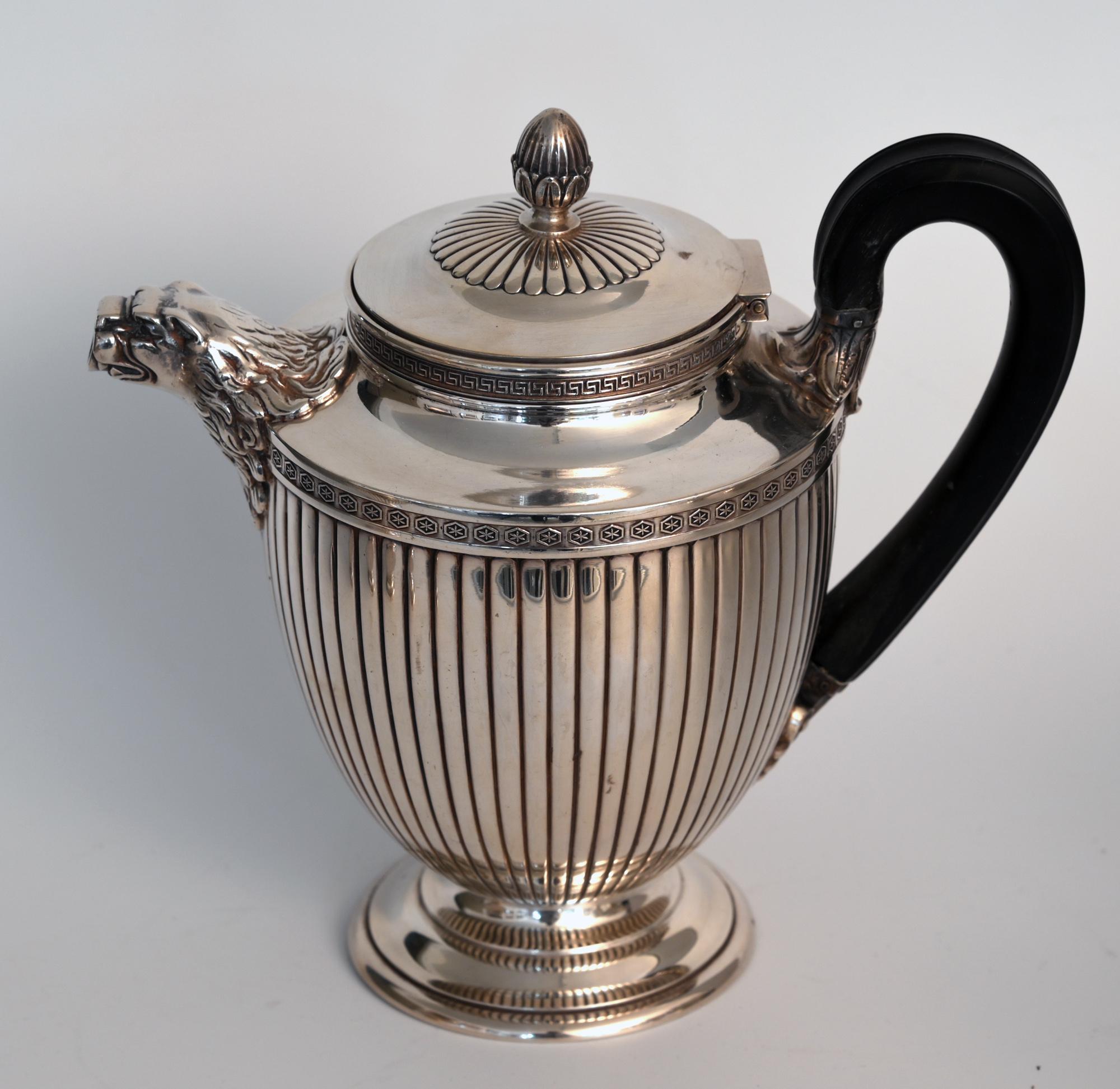 A timeless set for tea and coffee in neoclassical form in silver 950 with wood handle, from the maker Jean E. Puiforcat
These are a beautiful and timeless set for tea and coffee, consisting of a tea pot, coffee pot, creamer and sugar bowl. Fully