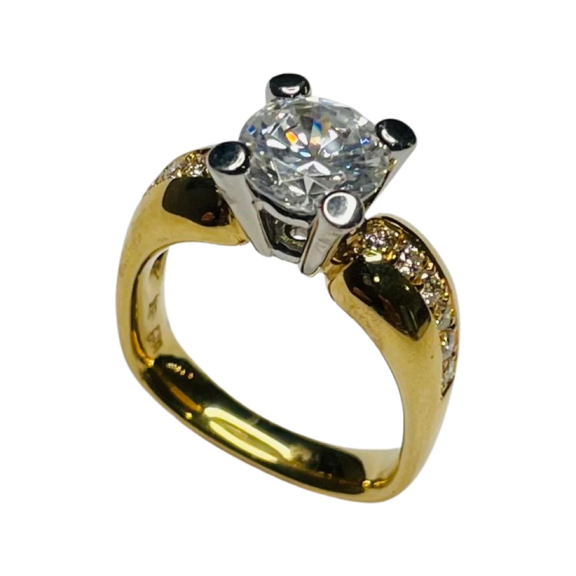 JFA 18K Yellow Gold & Platinum Diamond Engagement Ring. The center stone is a 8.0 mm Cubic Zirconia set in a platinum four prong head. It is equivalent in size to a 2.0 carat diamond. It can be replaced with a colored stone, moissonite or natural or