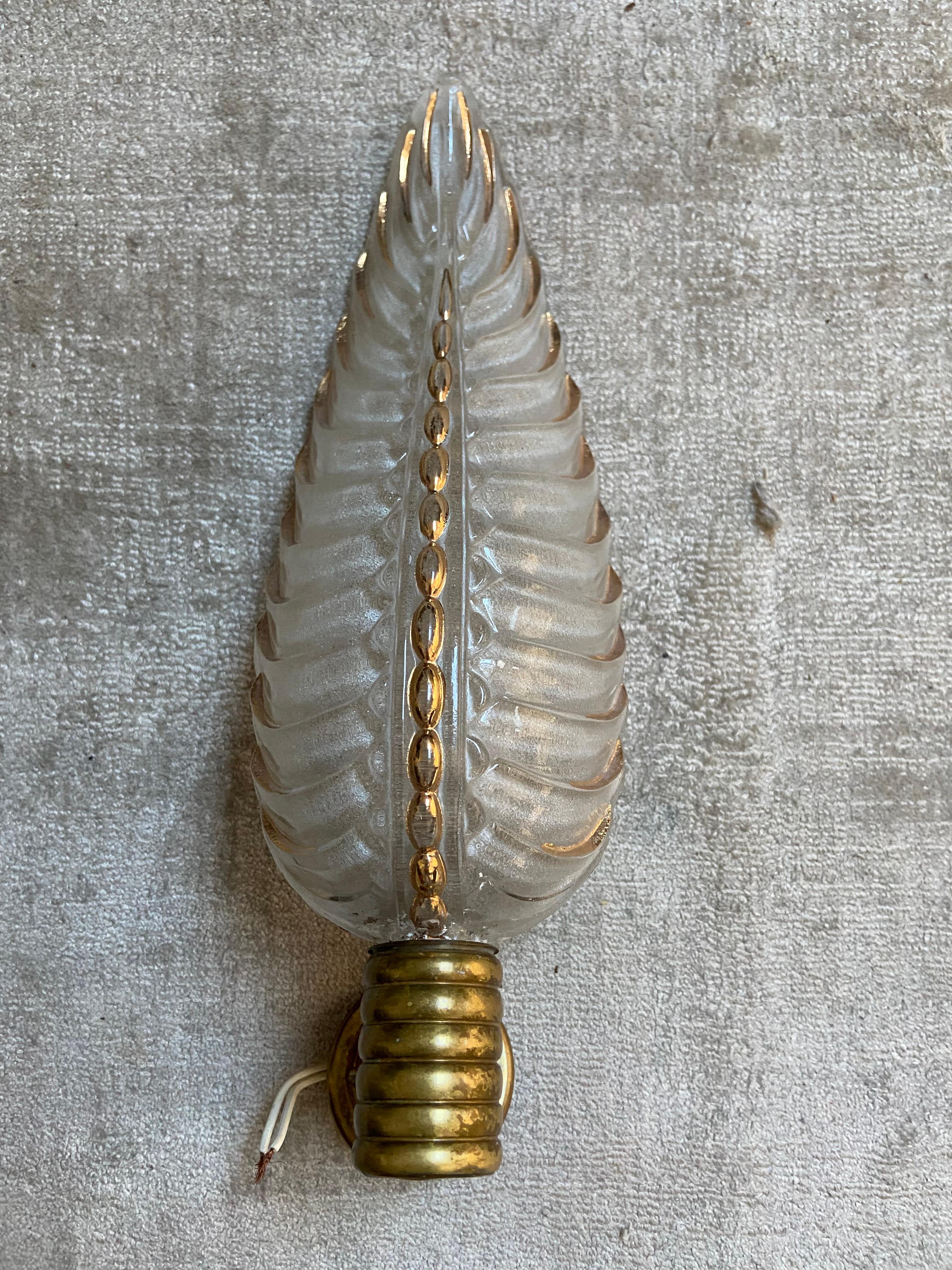 This beautiful sconce is the result of a most fruitful French Art Deco collaboration in the 1930's: Henri Petitot, a leader of the French modernist movement in Paris and Jean Gautier, a producer of Art Deco glassware in molded press-glass who signed