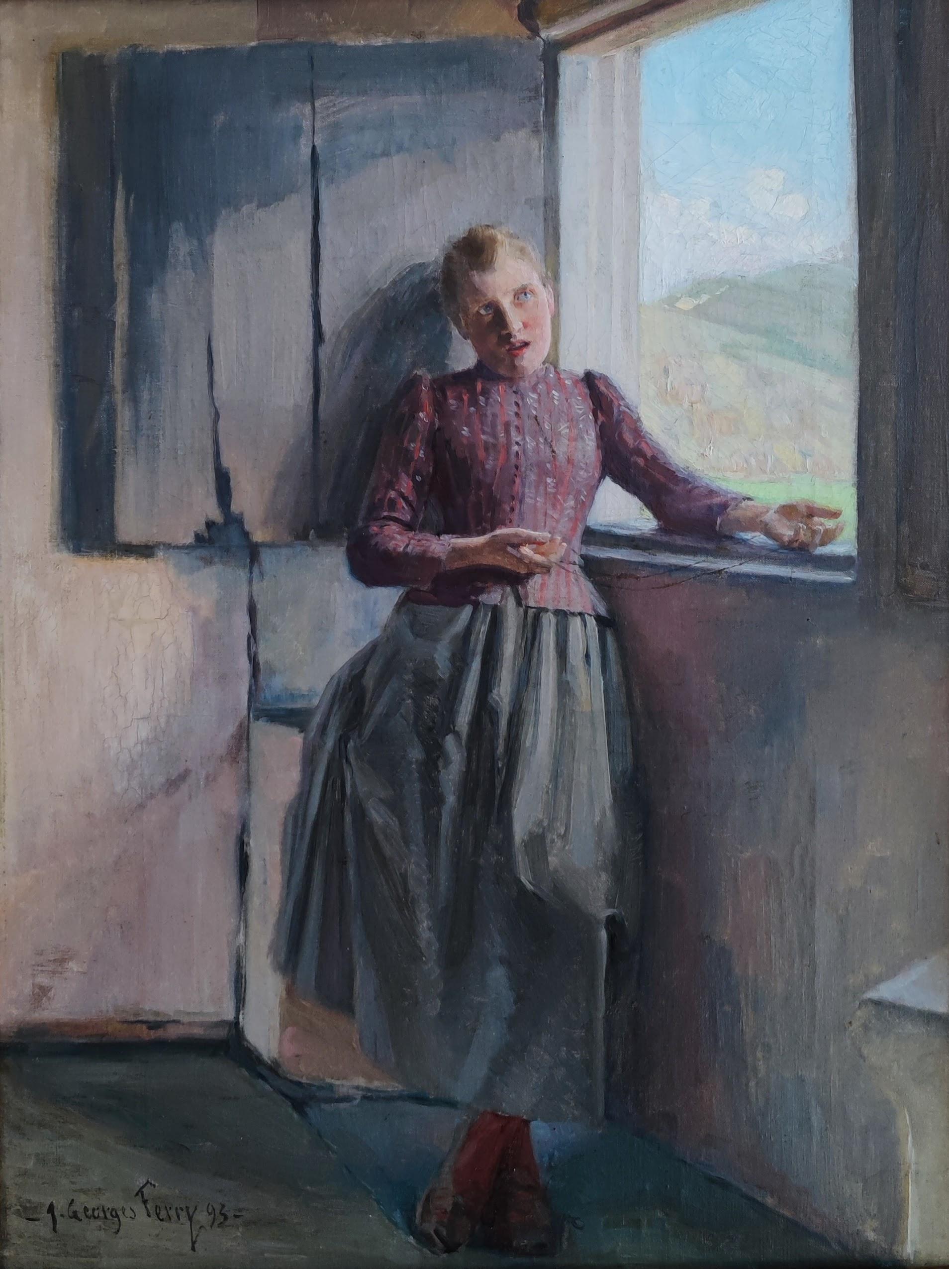 Young girl standing at the window