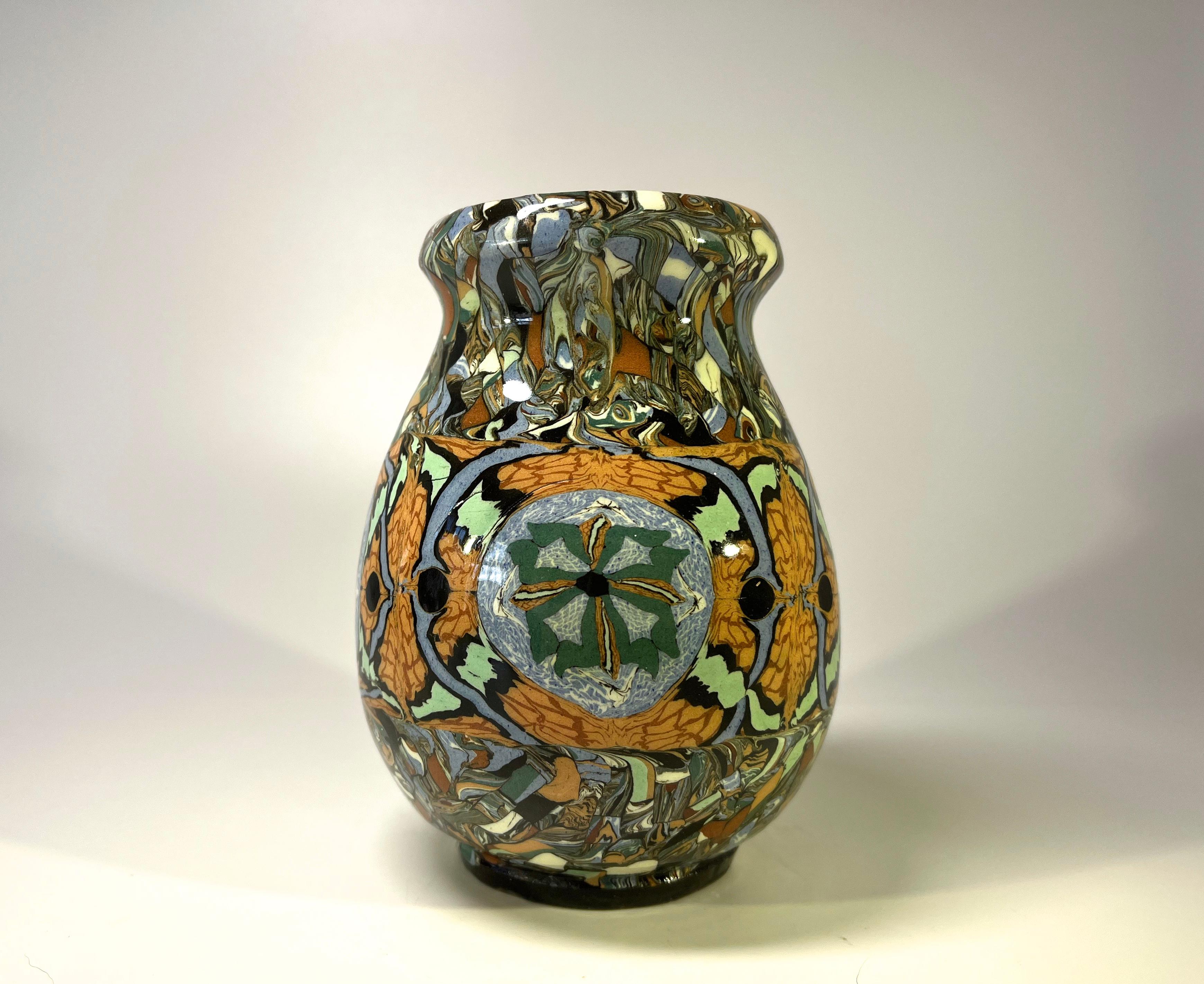 Jean Gerbino for Vallauris, France, ceramic glazed mosaic, shaped vase in muted tones
Fascinating mosaic design 
Circa 1960's
Signed Gerbino to base
Measures: Height 5.25 inch, diameter 4 inch, 
In very good condition. 
Wear consistent with