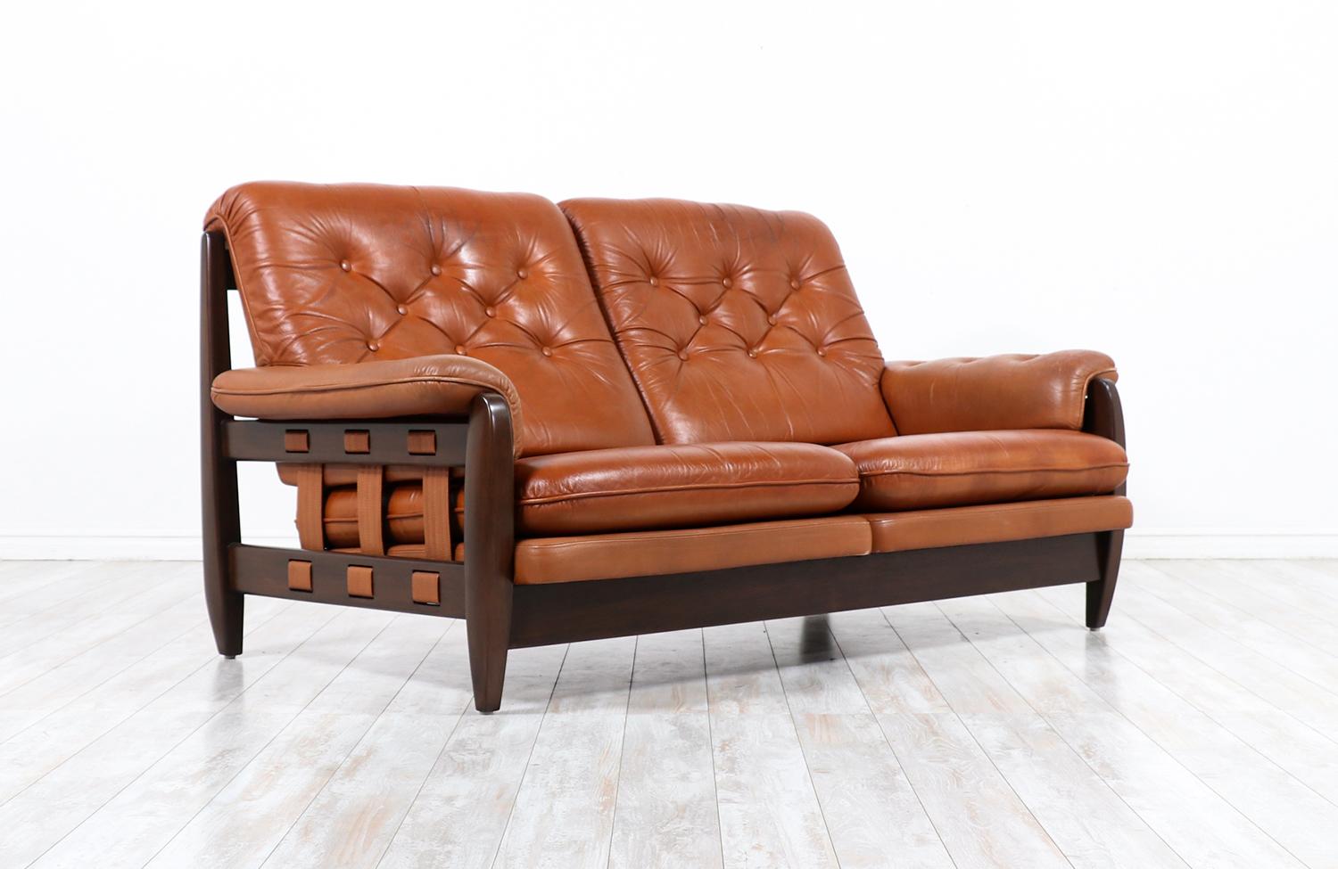 Jean Gillon distress cognac leather sofa for Italma wood art.