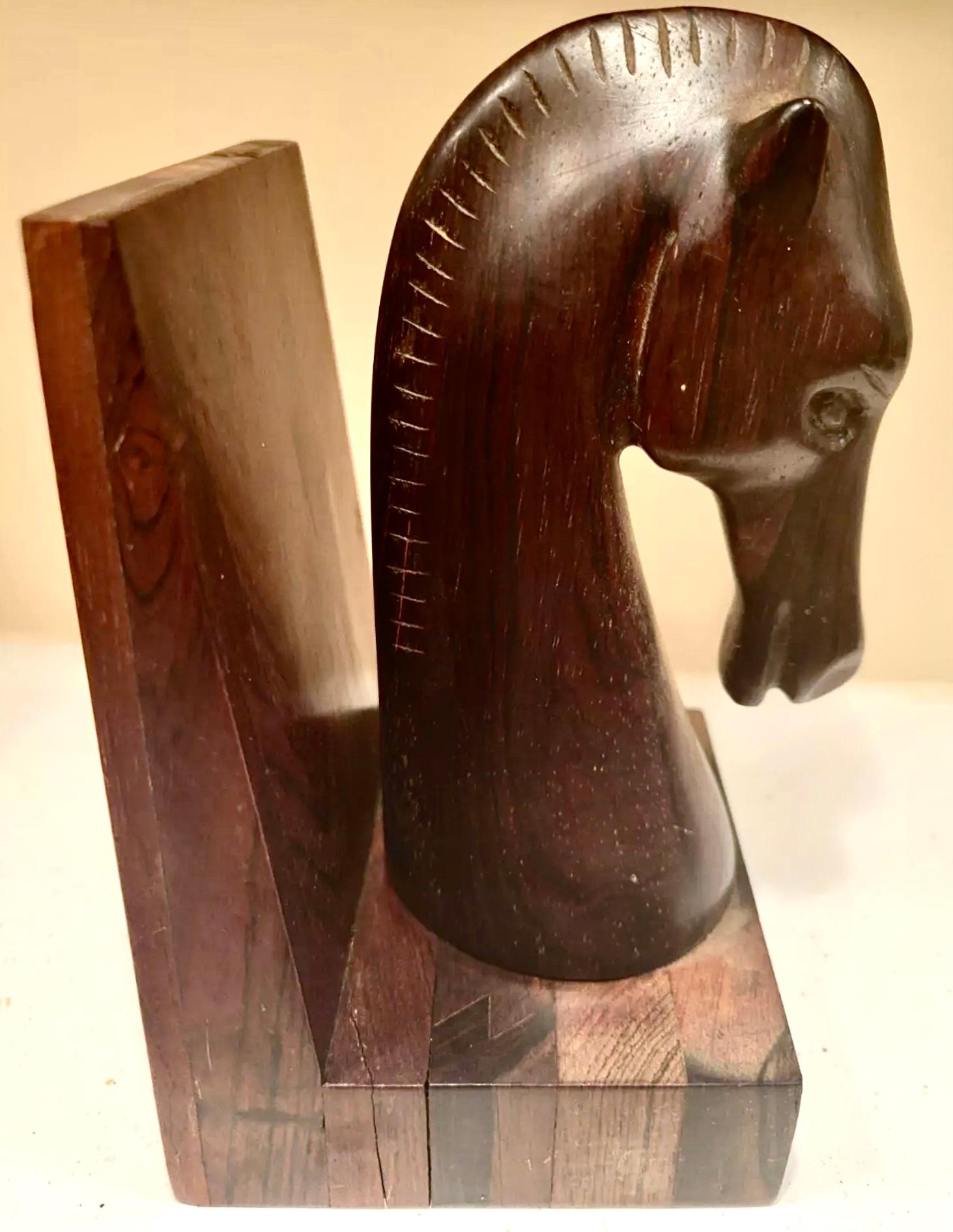 Jean Gillon Mid-Century Jacaranda Equine Sculptural Bookends, Brazil, 1960s.  Handcrafted with hard rosewood (also known as jacaranda), rare pair of horse head bookends by Jean Gillon for Italma Wood Art, 1960s.  Gorgeous clean clean lines with