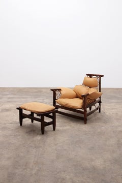 Jean Gillon 'Jangada' lounge chair and ottoman in tropical wood and leather.