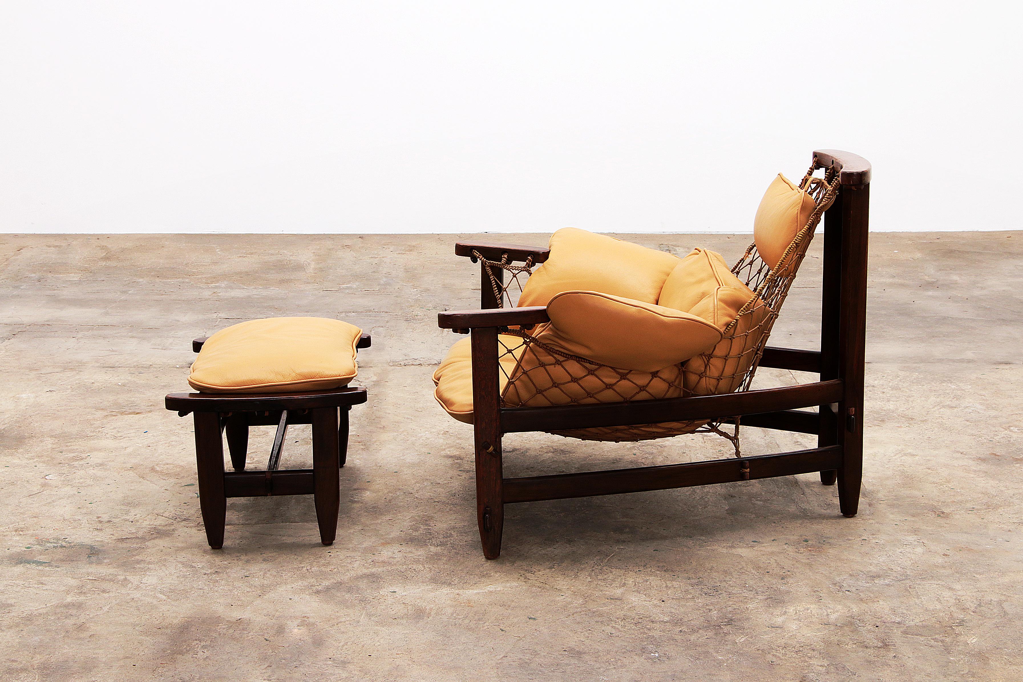 Jean Gillon 'Jangada' lounge chair and ottoman in tropical wood and leather. In Good Condition In Oostrum-Venray, NL