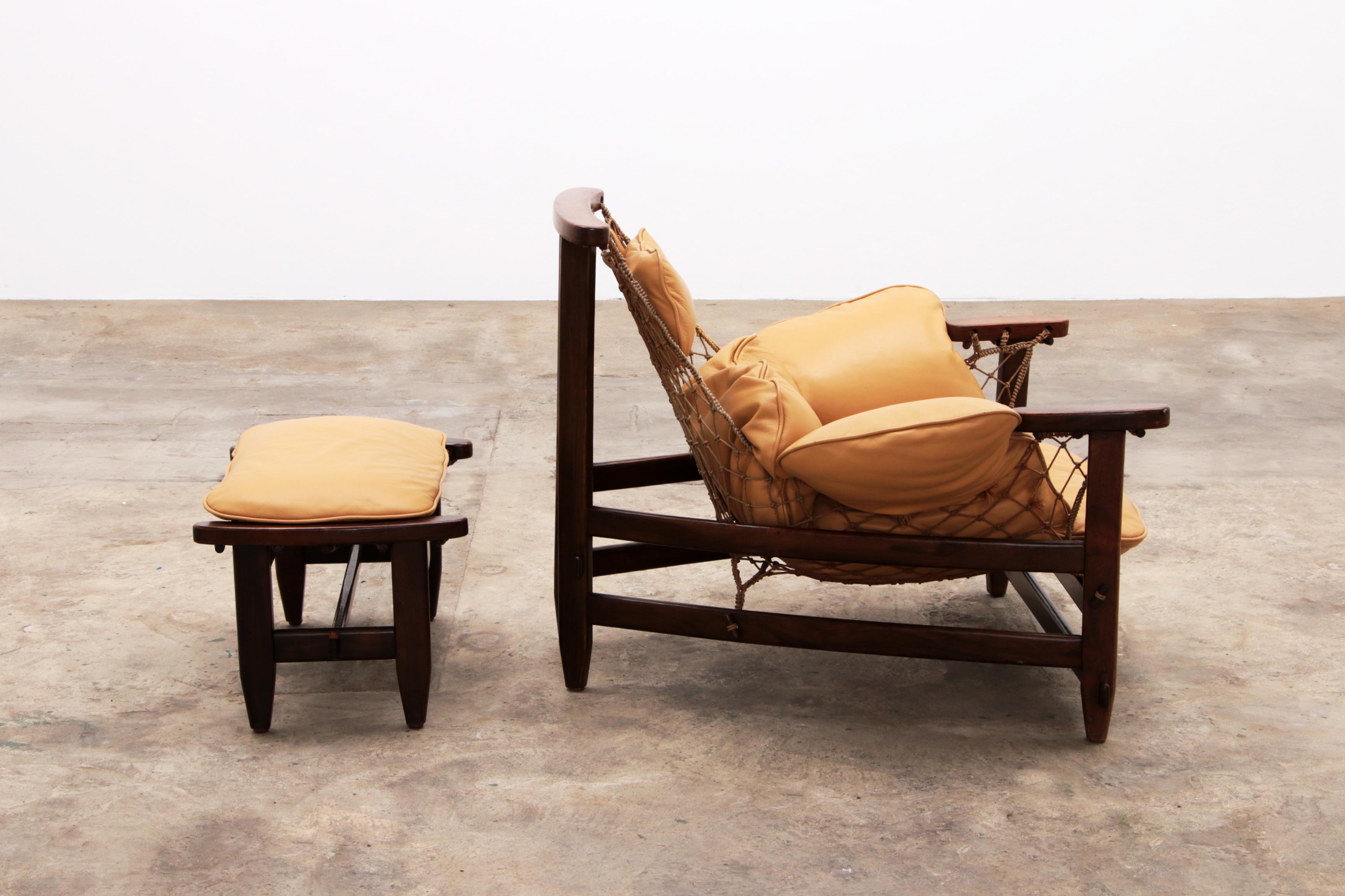 Leather Jean Gillon 'Jangada' lounge chair and ottoman in tropical wood and leather.