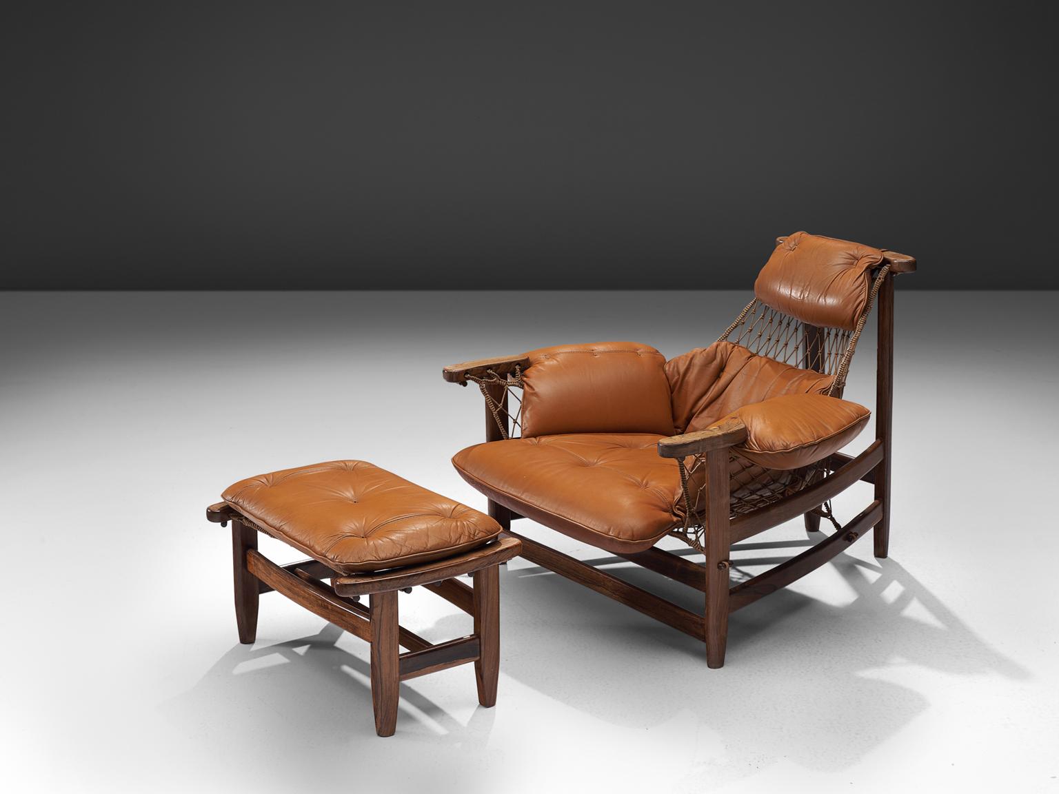 Jean Gillon, 'Jangada' armchair and ottoman, rosewood, nylon rope, cognac leather, Brazil, 1968.

This robust and hefty armchair is designed by Jean Gillon. The originality of this Janganda comes from the concept of the body being captured by the