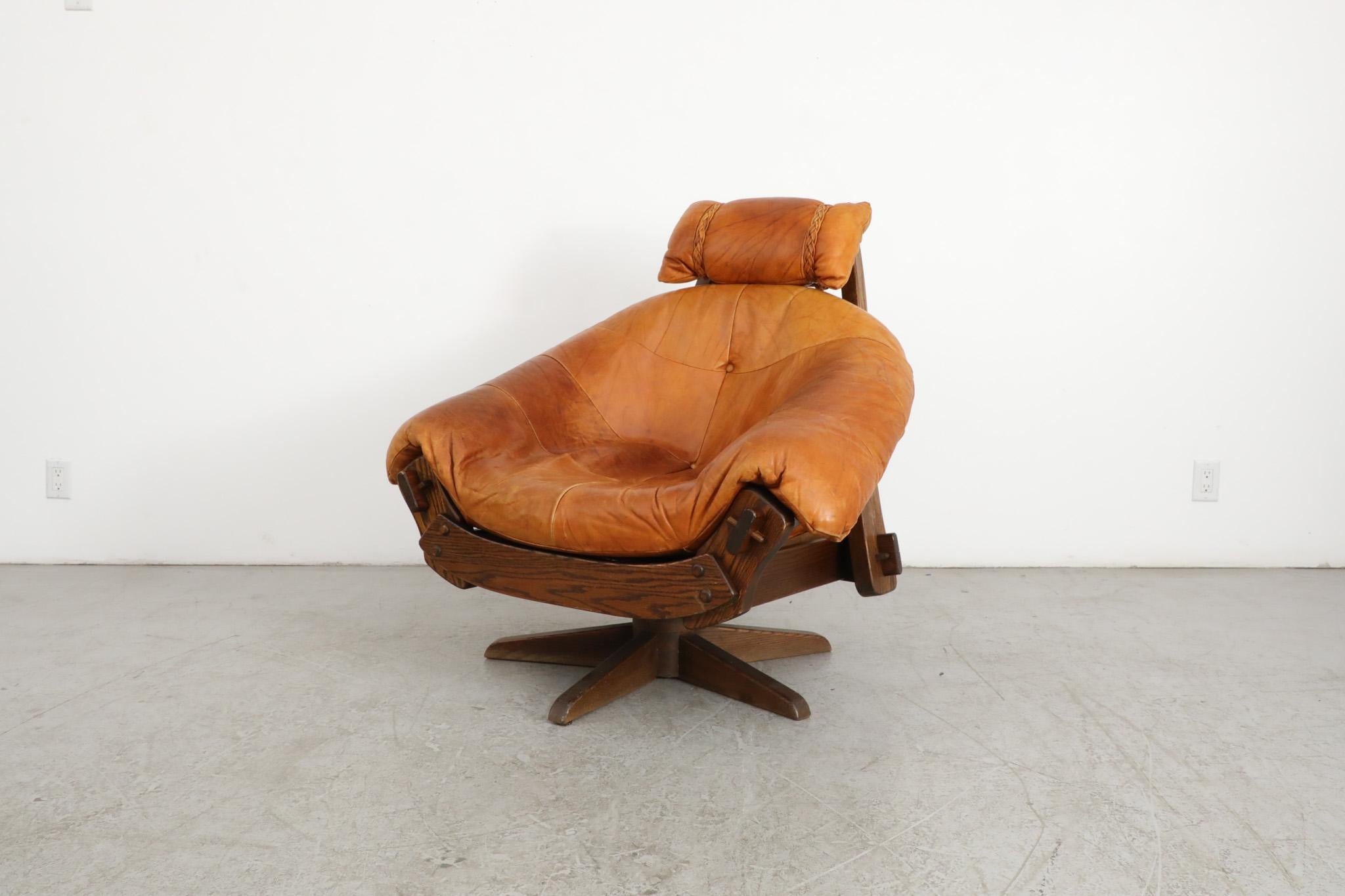 Mid-Century Modern Jean Gillon Style Brutalist Cognac Leather and Oak Swivel Lounge Chair For Sale