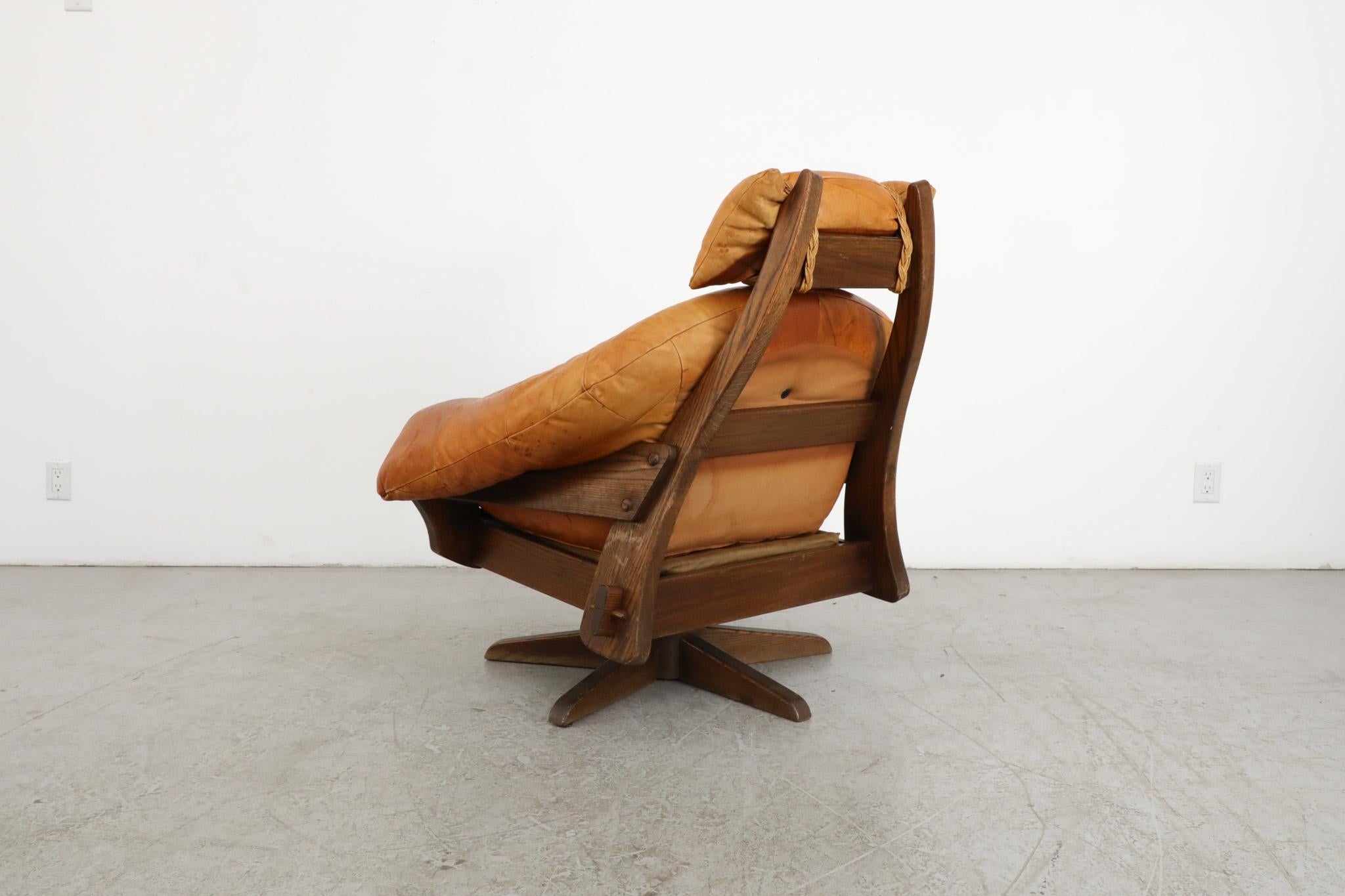Jean Gillon Style Brutalist Cognac Leather and Oak Swivel Lounge Chair In Good Condition For Sale In Los Angeles, CA