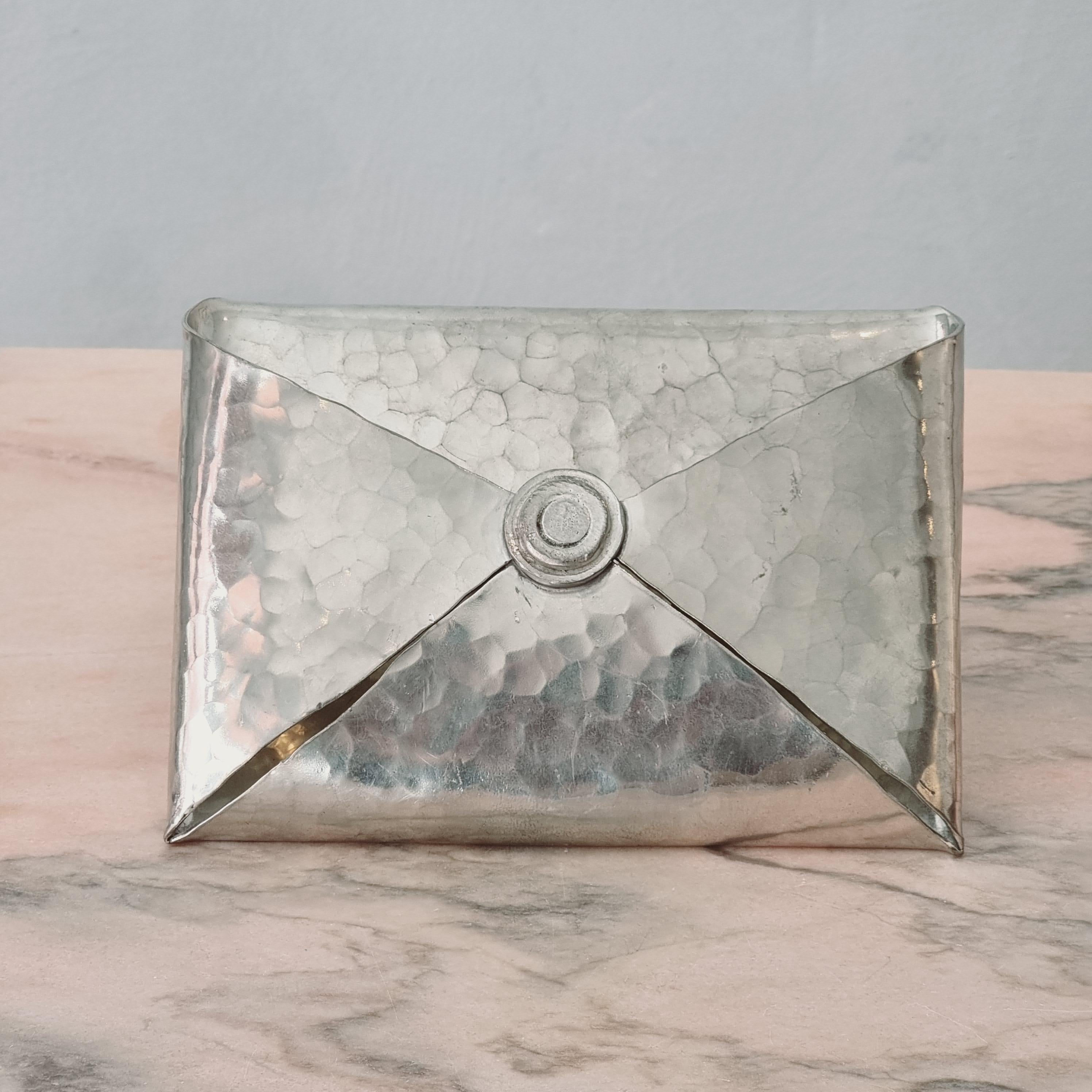 Letter / magazine holder in hammered handmade pewter by Jean Goardere. France, 1970s.  Marked: 95% ETAIN FAIT MAIN, Jean Goardere FRANCE. 

In good condition, nice patina. Smaller sign of age and wear. 