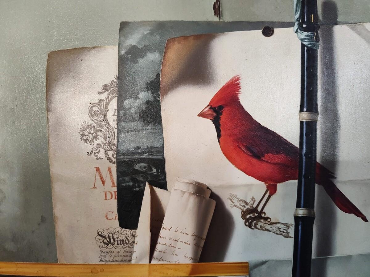 This captivating trompe-lœil painting showcases Jean Grimal’s extraordinary mastery of illusion. A vivid red cardinal, a black wooden flute, curling manuscripts and brittle music sheets appear to be pinned against an aged panel. Every detail — the