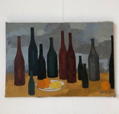 Bottles and cut of oranges and lemon