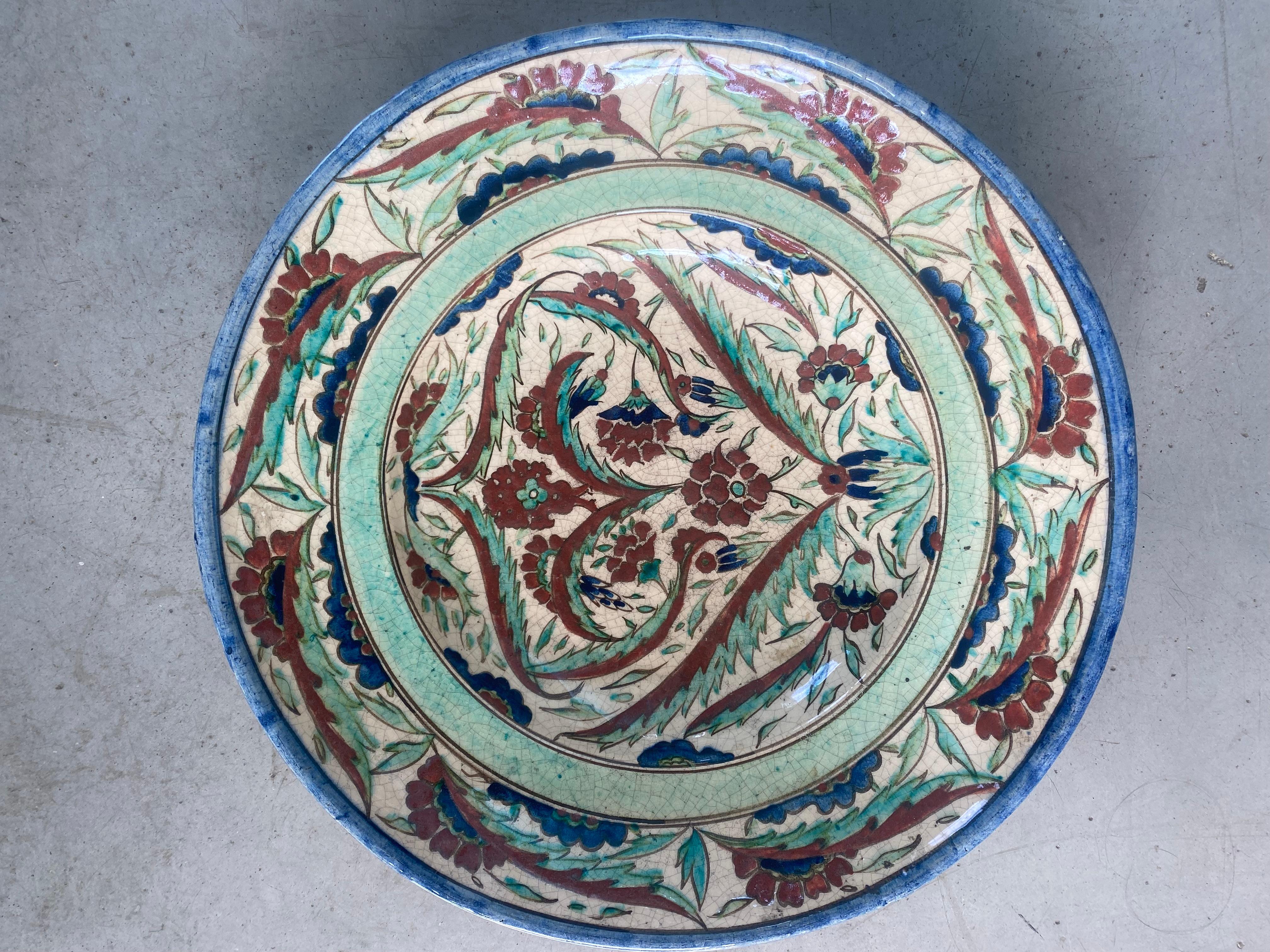 Jean Jacques lachenal
Large glazed earthenware bowl with floral decoration in the Iznik style.
White earthenware with red, green and blue polychrome enamels.
Signed under the base Lachenal with the monogram AL.
36 cms diameter x 9 cms high 
Perfect