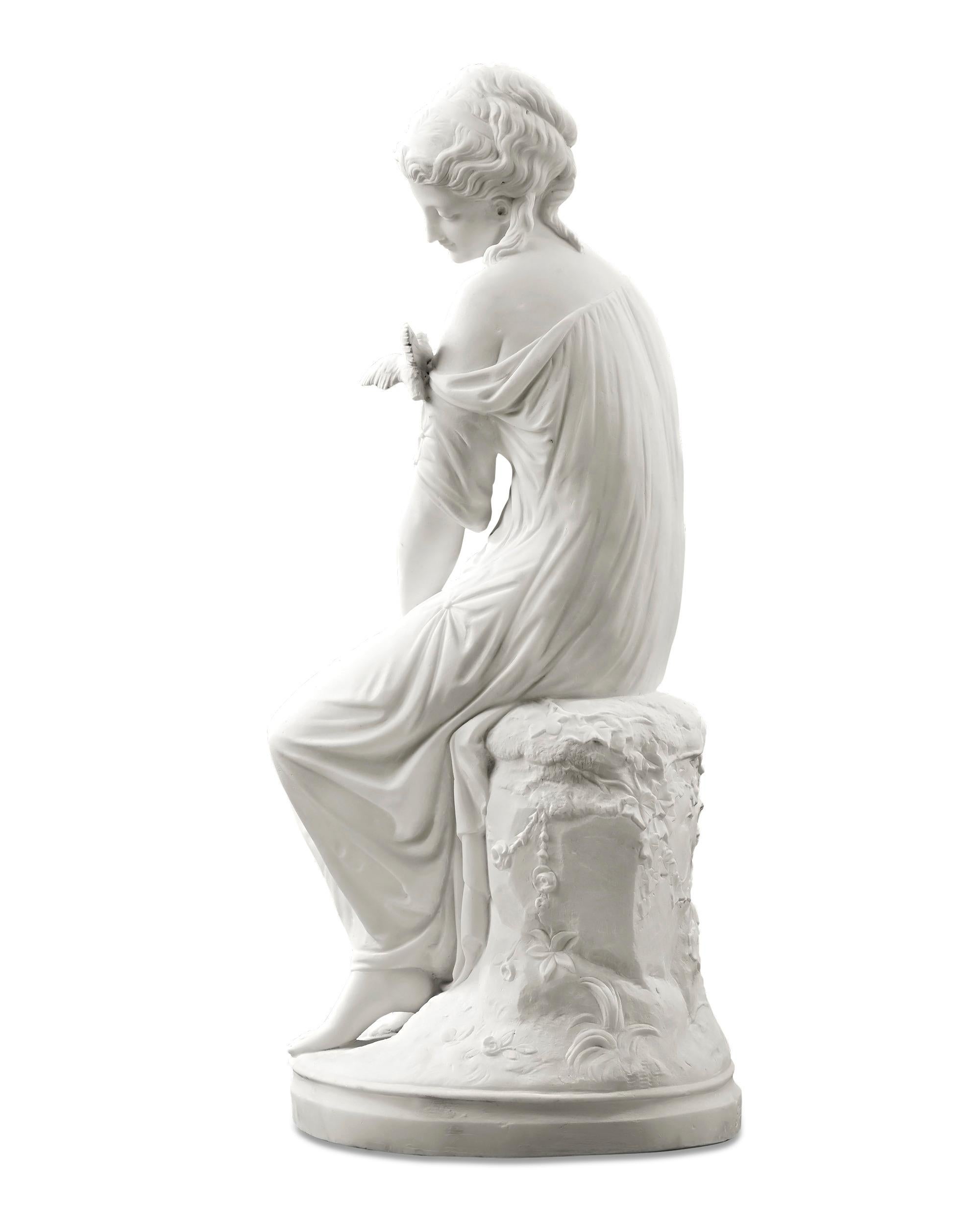 Signed and dated “Jacques Pradier / 1820”

This tranquil marble sculpture is by Swiss-French Neoclassical sculptor Jean-Jacques Pradier. Created in 1820, this work depicts a lovely young woman feeding a friendly songbird that has landed on her arm.