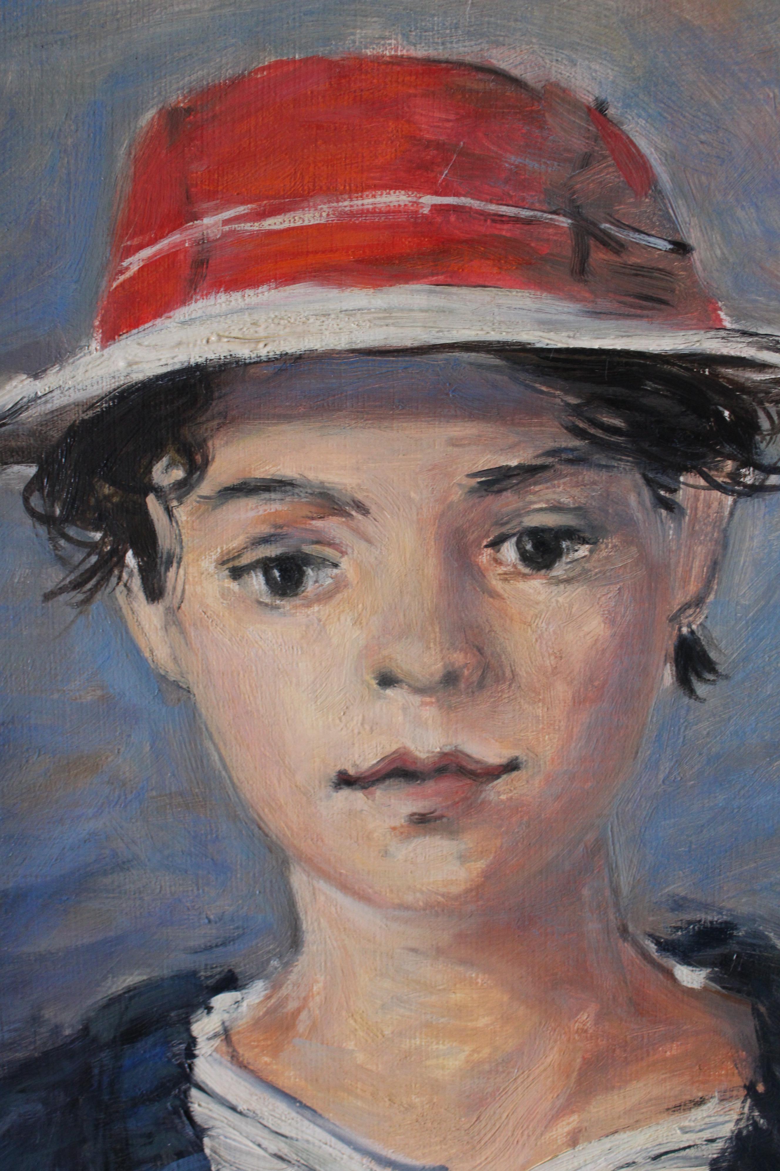Quadro a olio d'epoca raffigurante un ragazzo con un cappello rosso. Si tratta di un ritratto che ricorda il mare o la costa e che sarebbe ideale in una proprietà o in un bagno costiero.  Un ragazzo guarda direttamente l'artista, indossa un cappello