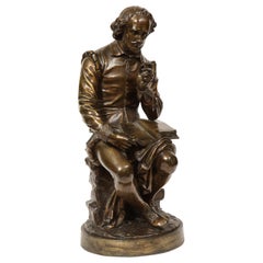 Sculpture en bronze de Jean Jules B. Salmson représentant William Shakespeare assis avec des livres