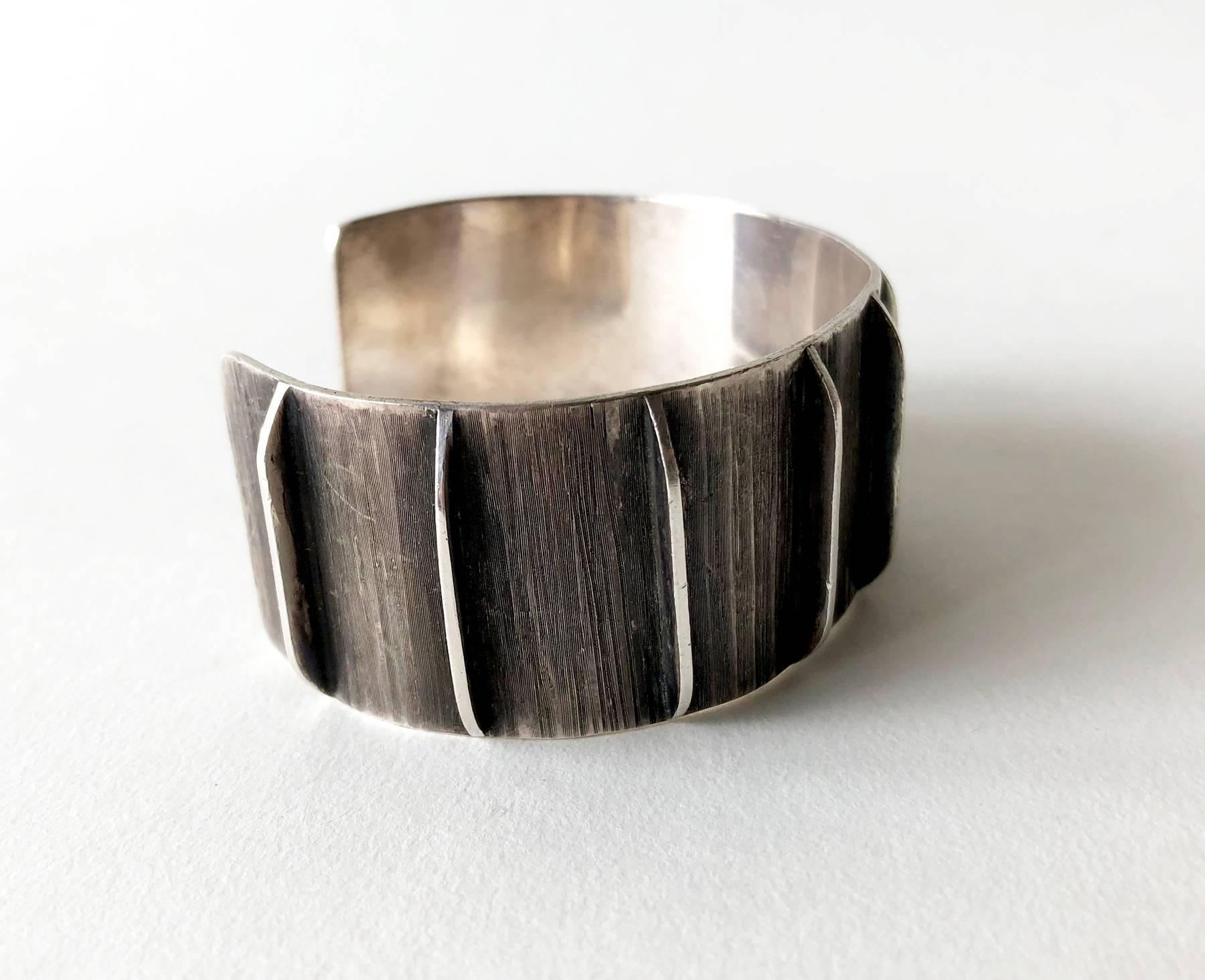 Hand made sterling silver cuff bracelet with oxidized sgraffito texture created by Jean Lasnier of San Francisco, California.  Bracelet measures 6 1/8