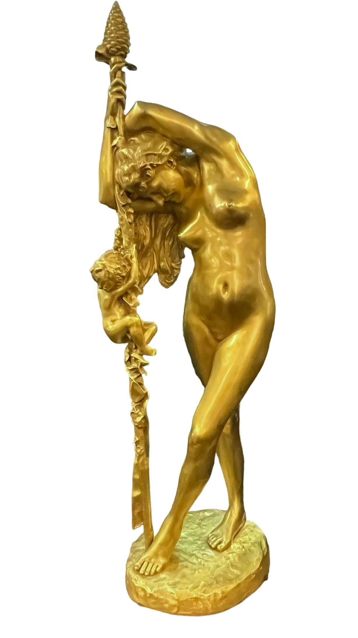 Our very large gilt bronze figure by Jean-Leon Gerome (1824-1904) depicts Venus holding and leaning upon a Dionysian staff with pine cone finial as Cupid clambers up the staff.  Based marked JL GEROME.