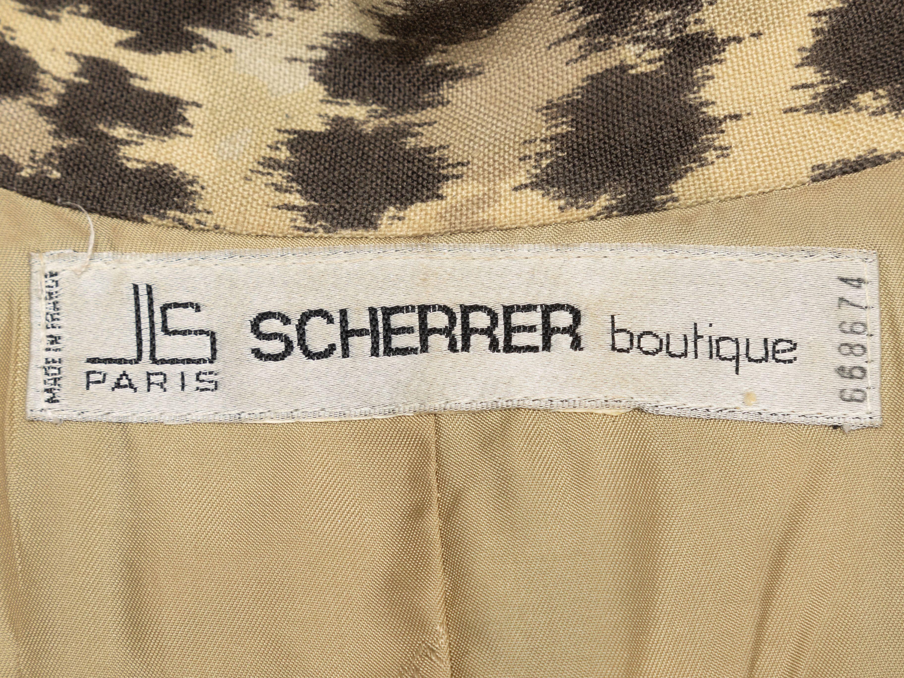 Product Details: Vintage beige and multicolor double-breasted leopard print blazer by Jean Louis Scherrer. Peaked lapel. Three pockets. Button closures at front. 38