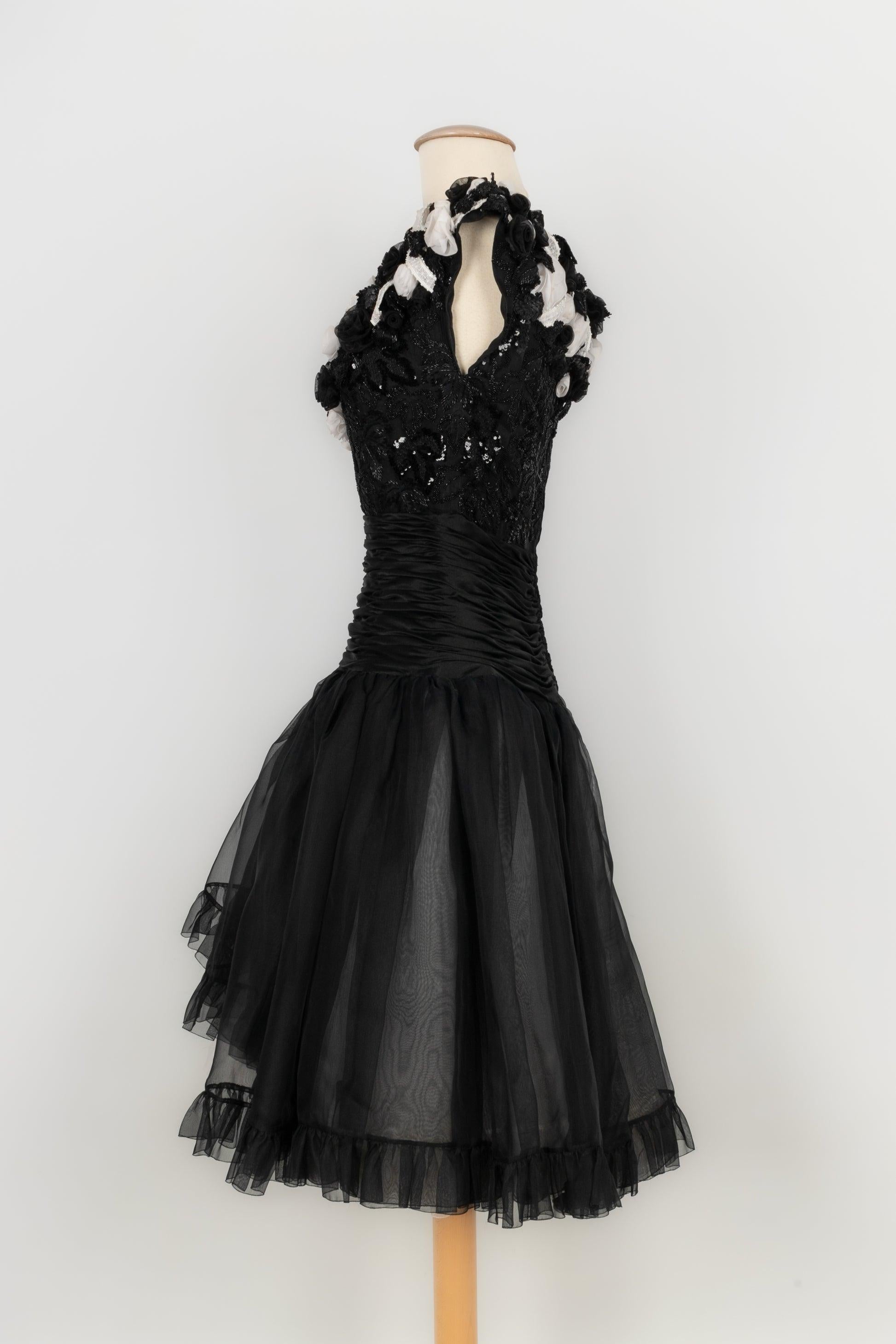 Jean-Louis Scherrer - (Made in France) Black and white organza Haute Couture dress. Black satin pleated waist and bustier embroidered with pearls and black sequins. No size nor composition label, it fits a 34FR/36FR. Piece from the