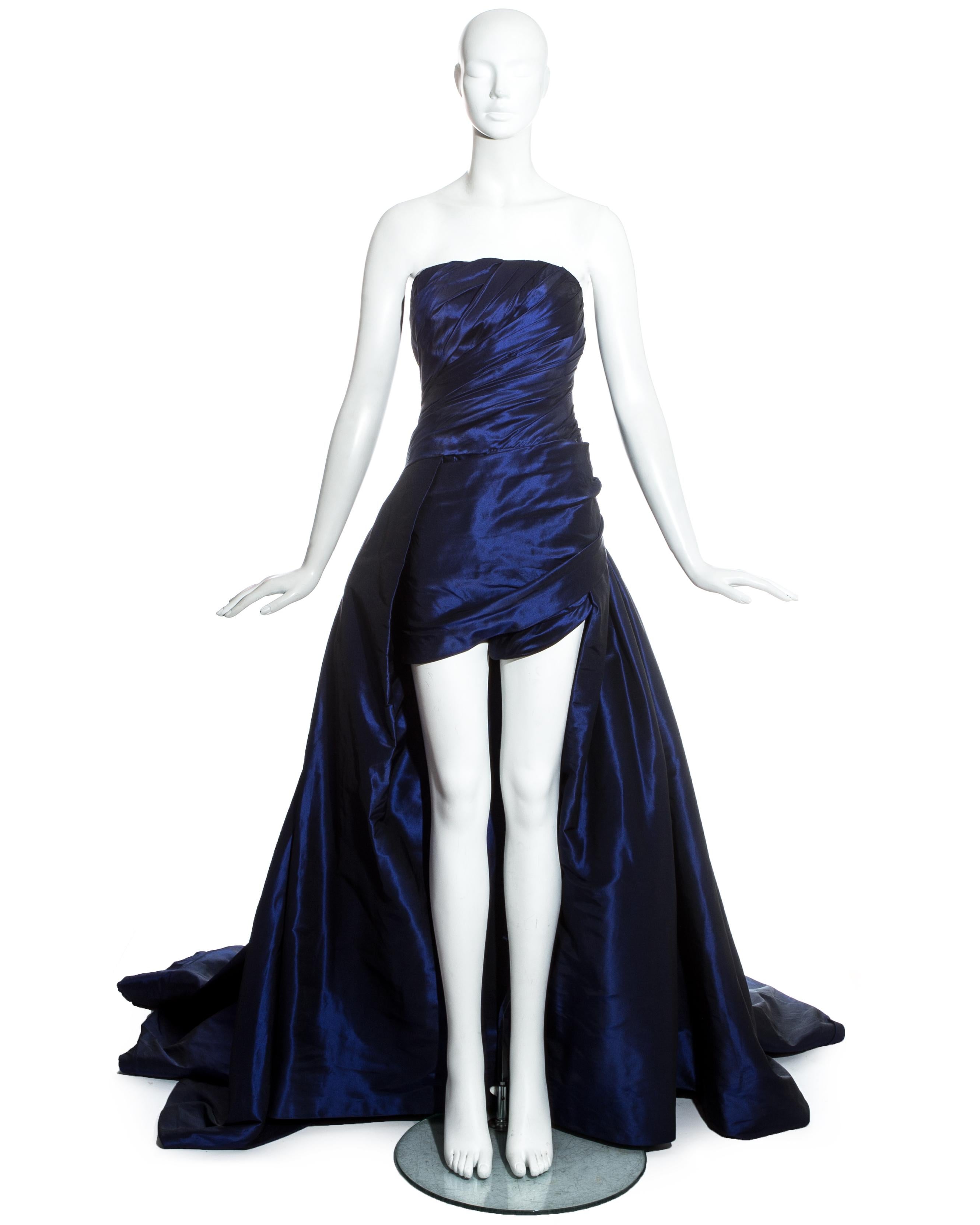 Jean-Louis Scherrer Haute Couture, blue taffeta evening gown with dramatic sweeping train, ruched bodice and internal playsuit with boning.

Spring-Summer 1994
