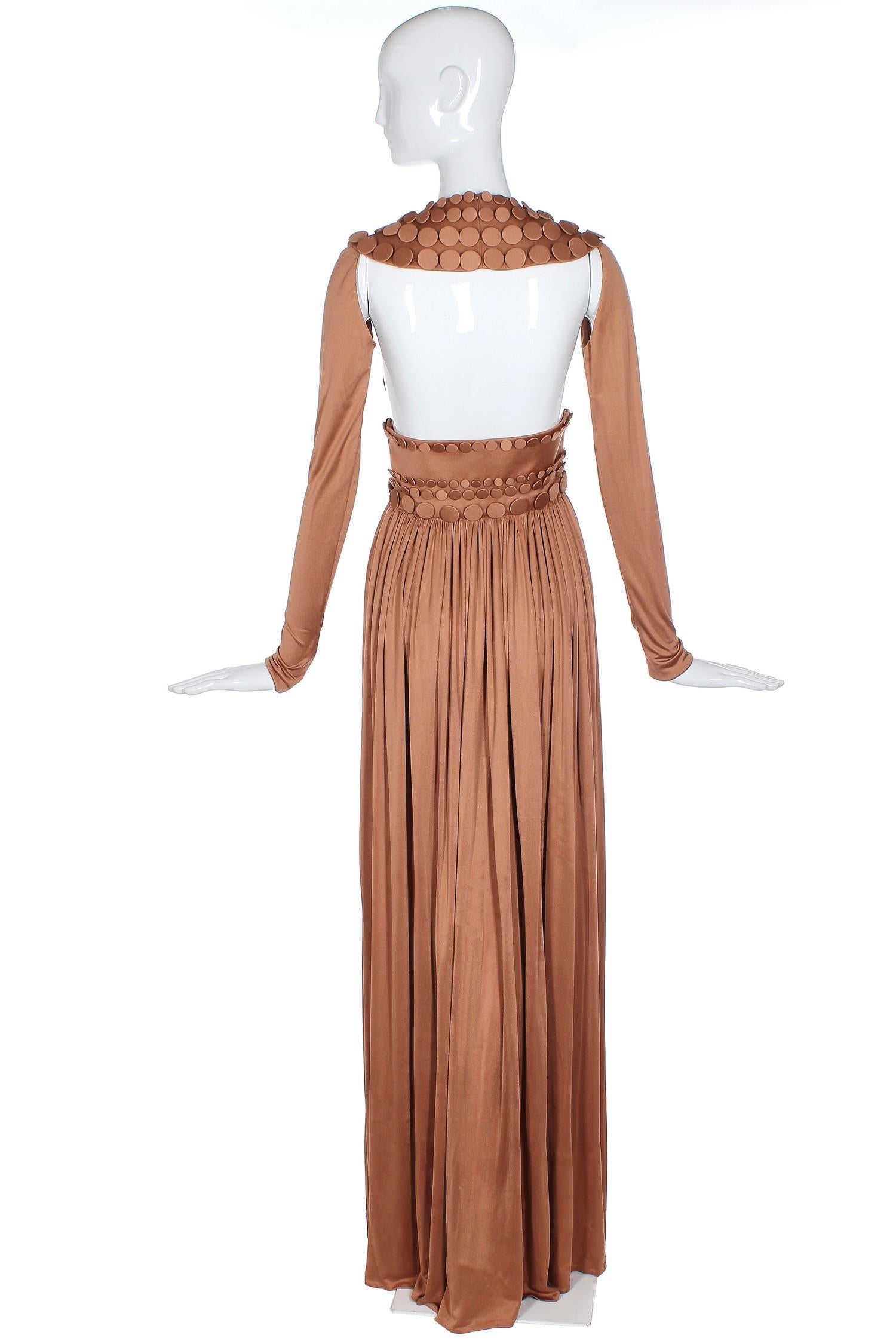 Jean-Louis Scherrer caramel-colored haute couture runway sample gown from Sprint Summer 2007. In very good to excellent condition with some scattered hard to see marks on the skirt. Please see measurements.
MEASUREMENTS:
Bust - 28