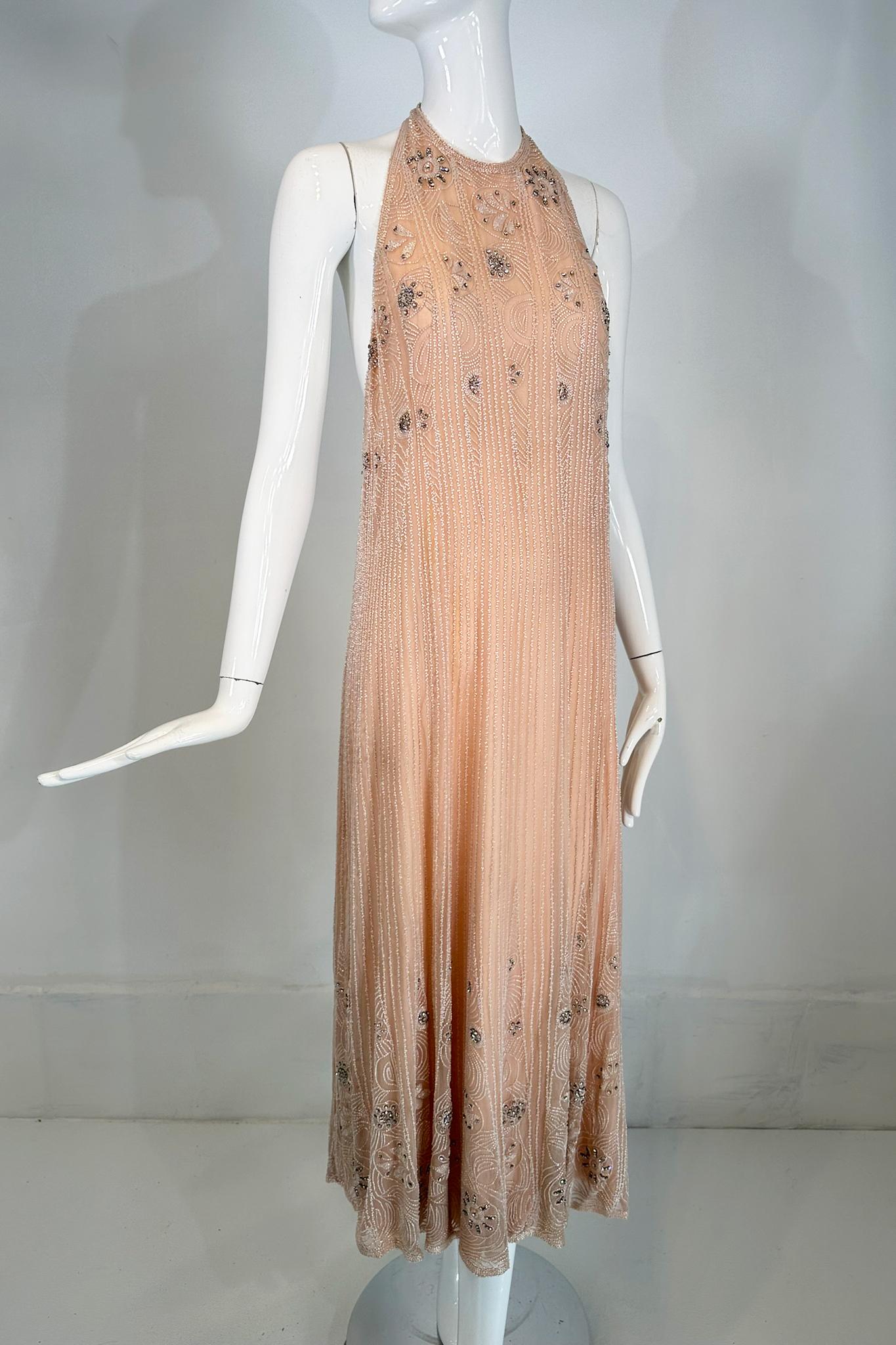 Jean-Louis Scherrer couture hand beaded pink silk mousseline & silk crepe de chine halter neck evening dress from the 1970s. Soft pink silk hand sewn with tiny frosted white glass tube beads & crystal rhinestones. The dress has a high halter neck