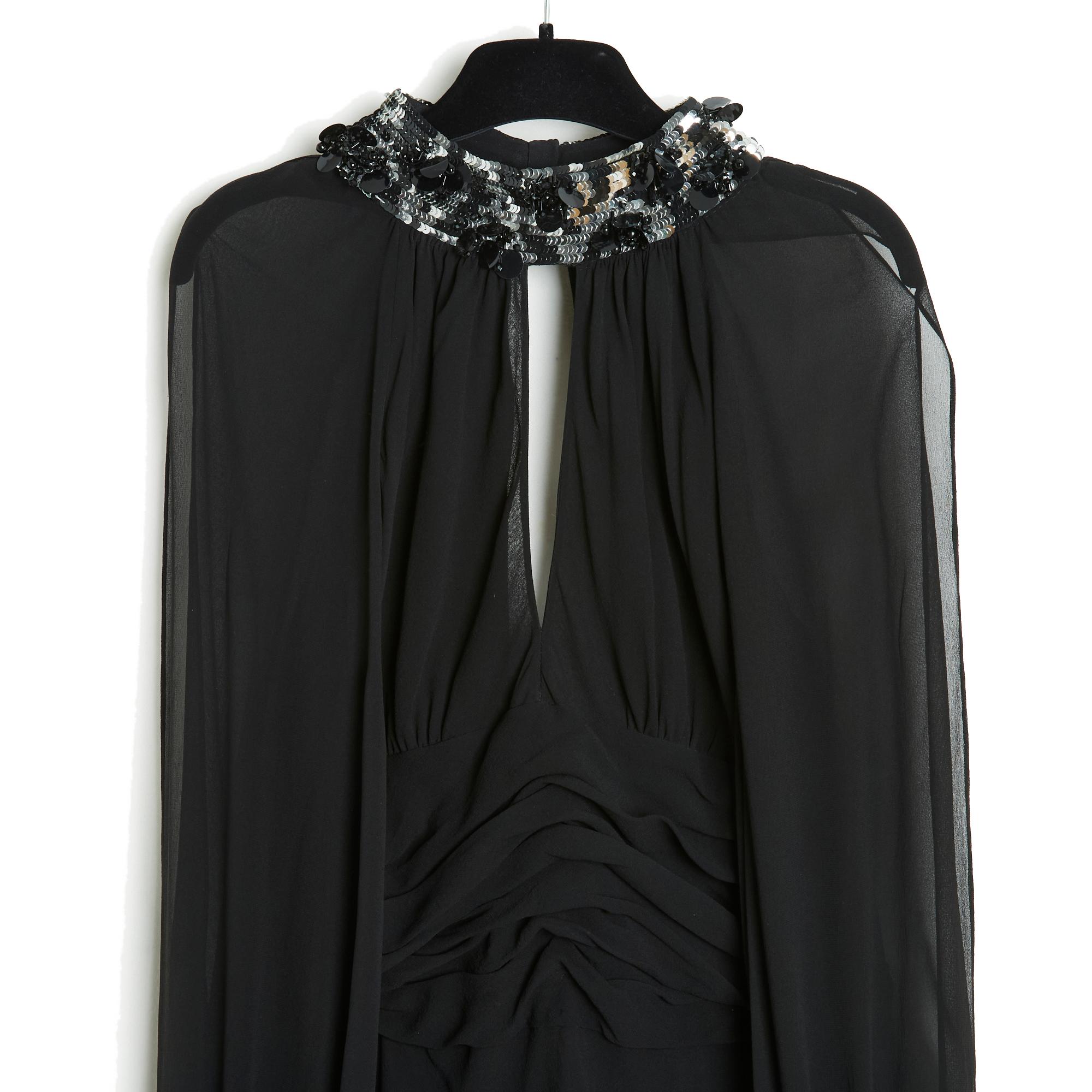 Jean Louis Scherrer maxi dress in black silk crepe, round neck embroidered with silver and black sequins and pearls, closed with 3 covered buttons at the back, pointed neckline at the front and back (a little deeper), long, slightly puffed sleeves,