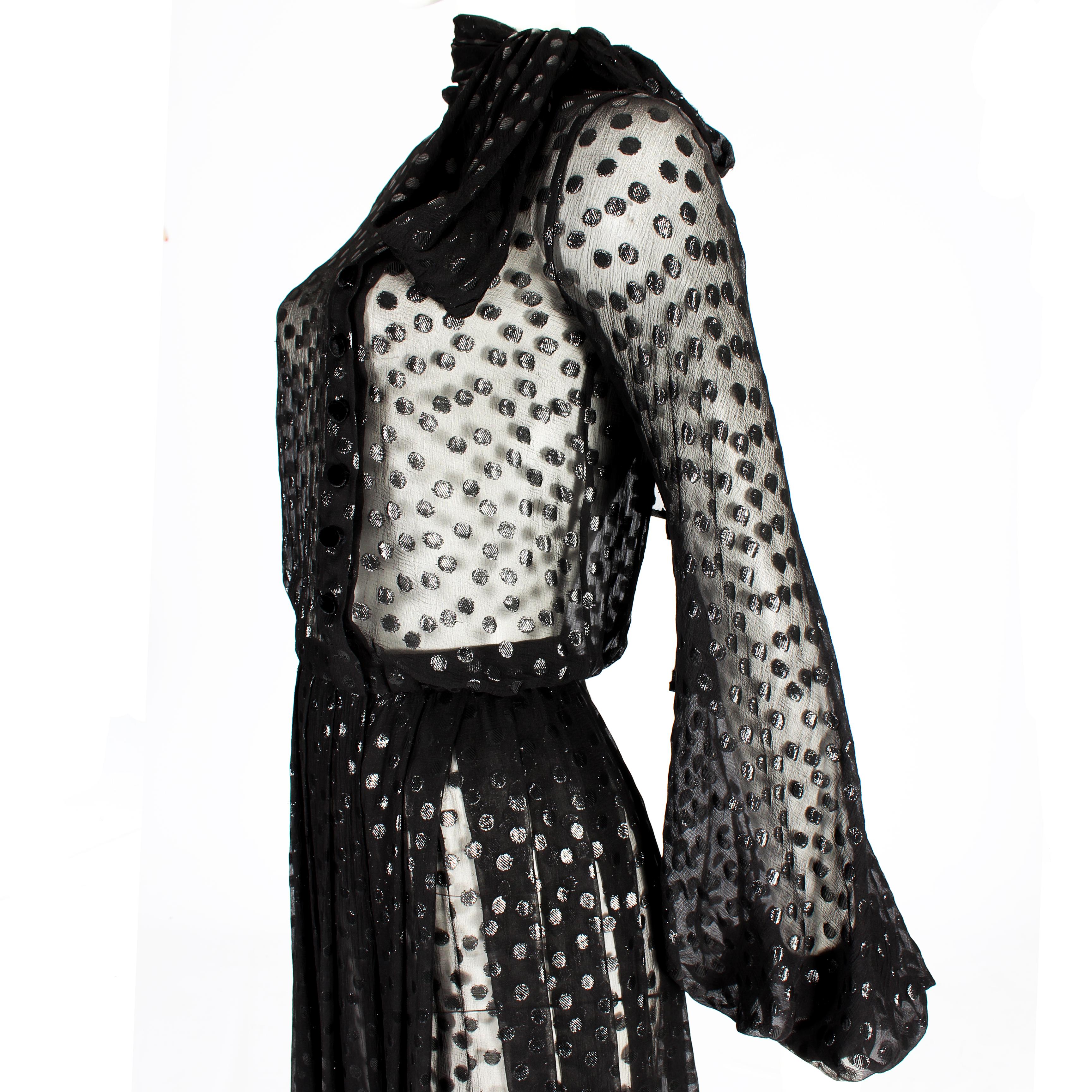 Jean-Louis Scherrer by Stéphane Rolland Haute Couture Autum / Winter 2005

- Sheer polka dots silk chiffon with black velvet covered buttons on bust and sleeves
- Victorian poet sleeve
- Pussybow detail around neck
- Ruffled bottom and pleated front