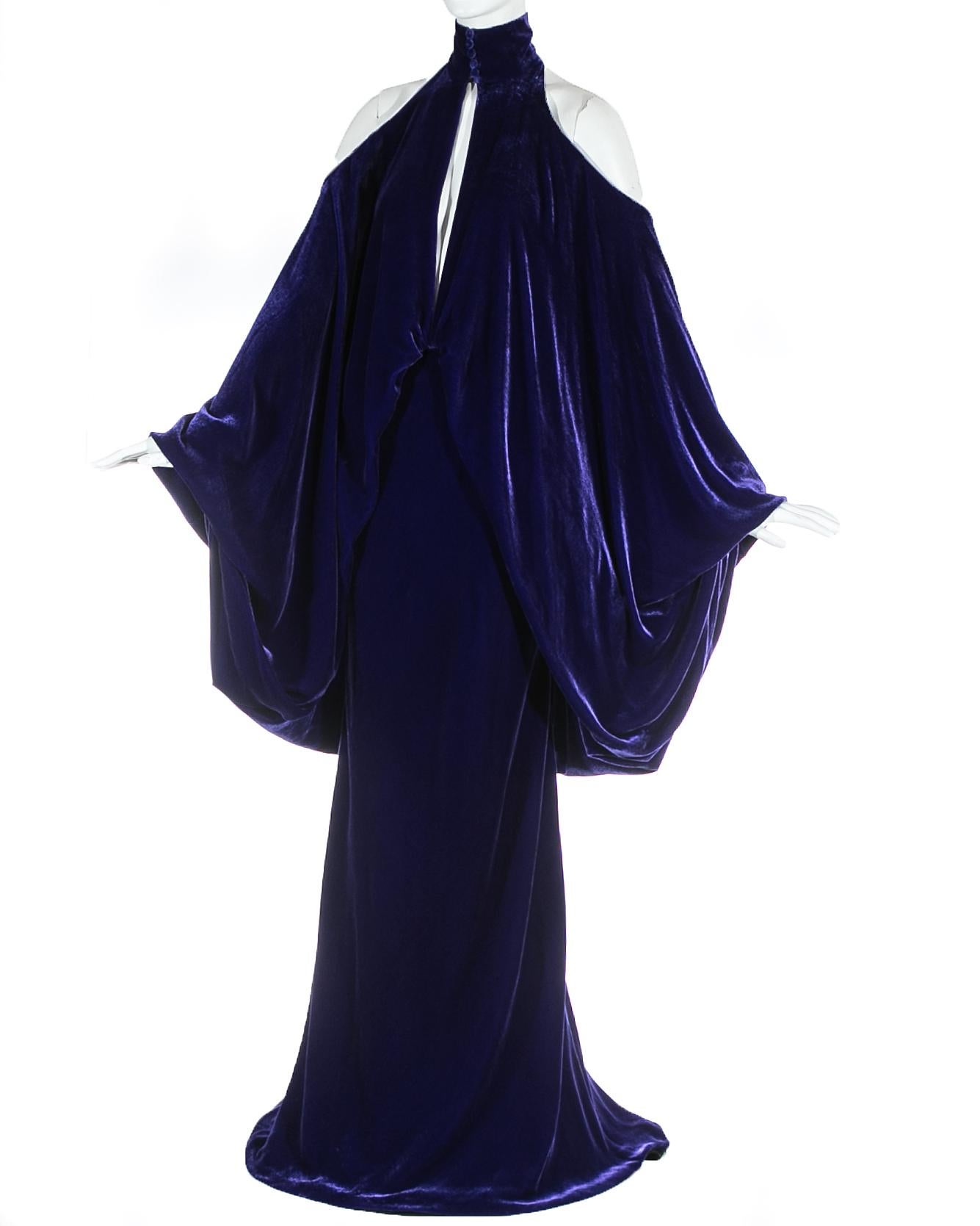 Purple velvet maxi dress with halter neck, open shoulders and back, peek-a-boo cleavage and exaggerated poet sleeves. 

Haute Couture Autumn-Winter 2005