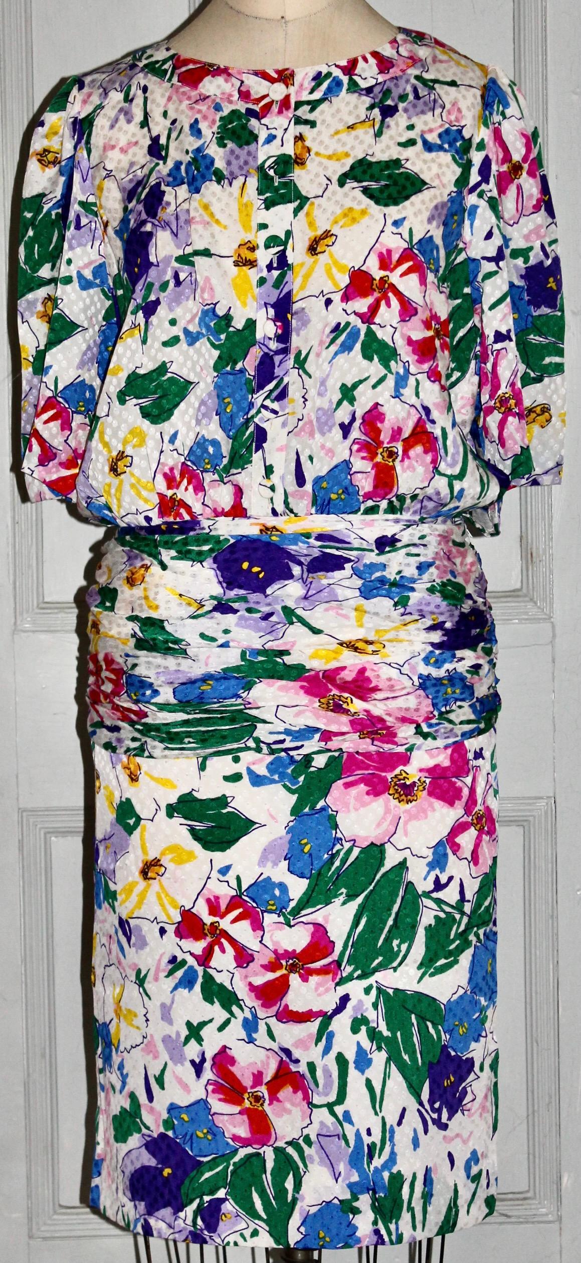 Offering a 1980's Scherrer floral printed silk dress, drawn in a loosely Dufy Fauvist manner.  Front buttoned, 'drop' waist, partial side zipper, skirt silk lined.  Size 42, numbered Paris label.
