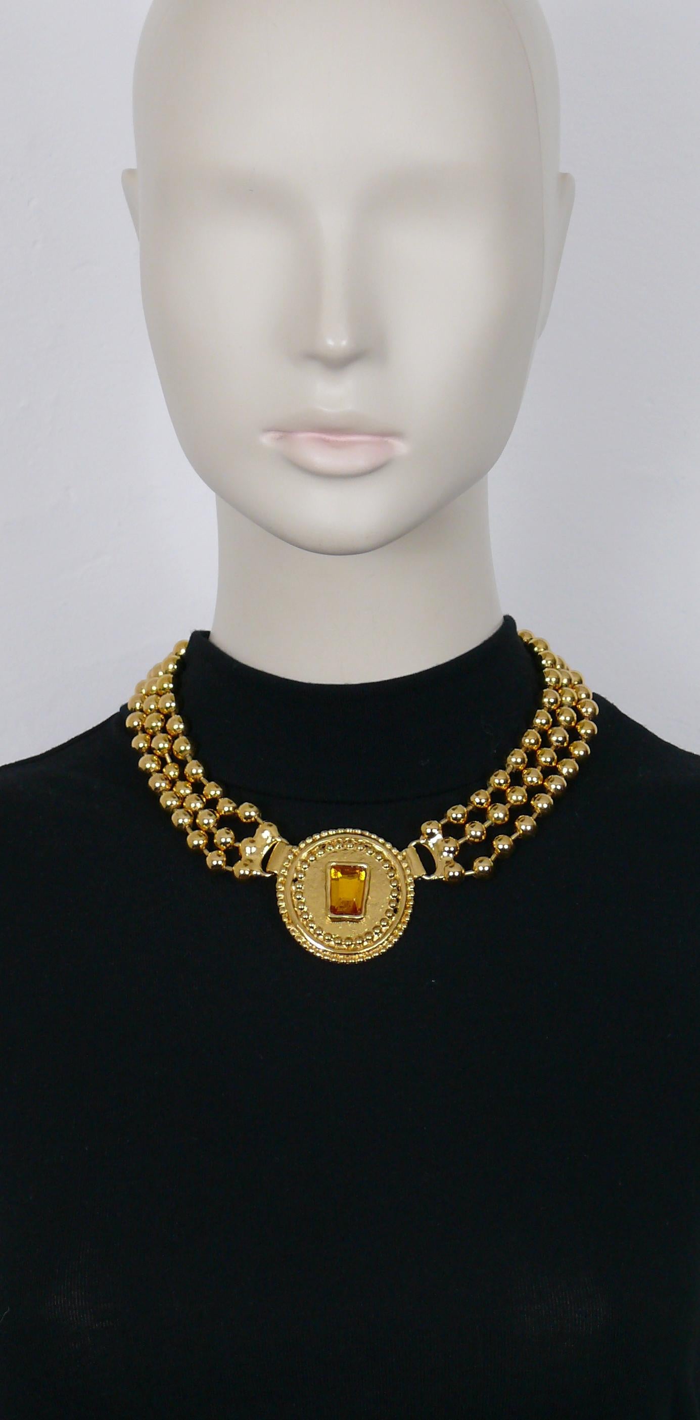 JEAN LOUIS SCHERRER vintage gold toned ball chains collar necklace featuring a shield shaped medallion embellished with an orange resin cabochon.

Hook clasp closure.

Marked SCHERRER Paris.
Made in France.

Indicative measurements : length approx.