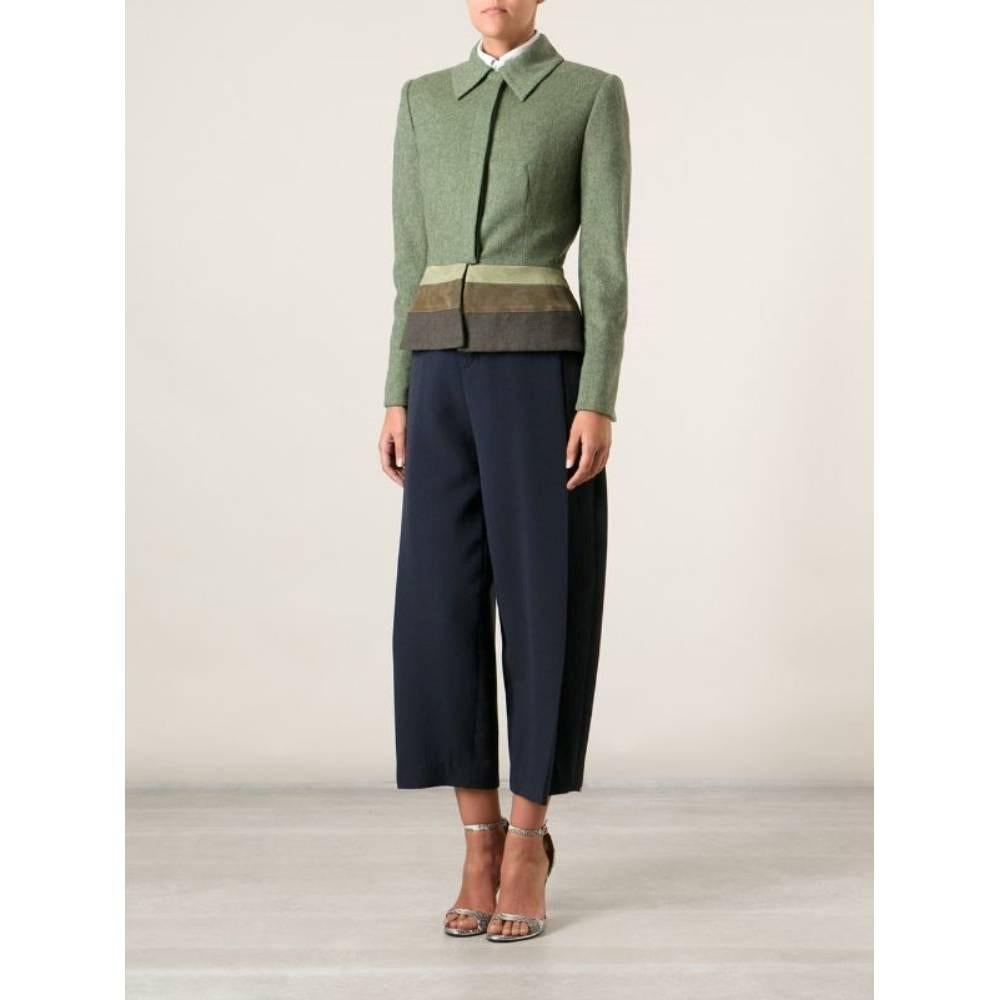 Jean-Louis Scherrer green shaved wool 90s fitted jacket with classic collar, suede detail on the bottom and frontal logoed buttons fastening.

Size: 44 IT

Flat measurements
Height: 63 cm
Bust: 45 cm
Sleeves: 60 cm
Shoulders: 40 cm

Product code: