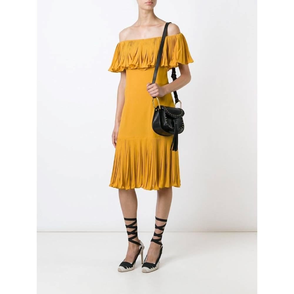 Jean-Louis Scherrer ochre silk 70s boatneck dress with pleats on the neck and on the bottom. Back zip closure.

Size: L

Flat measurements
Height: 93 cm
Bust: 40 cm

Product code: A7307

Composition: 100% Silk

Made in: France

Condition: Very good