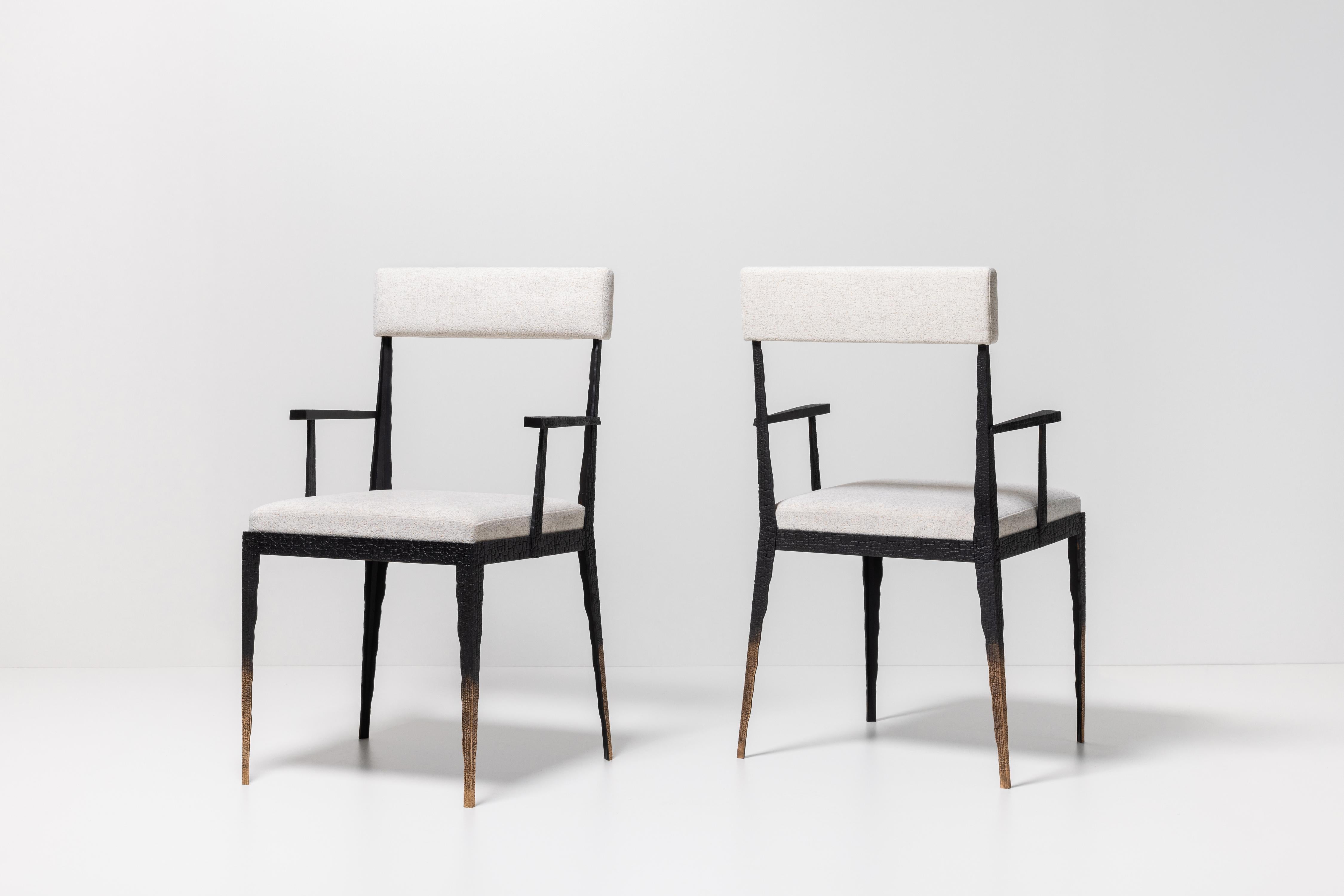 From his Empreinte Collection, a series of pieces centered around a theme of destruction and reconstruction, these chairs are composed of patinated bronze cast from broken and burned wooden planks. Fine, light, and comfortable (feats unto themselves