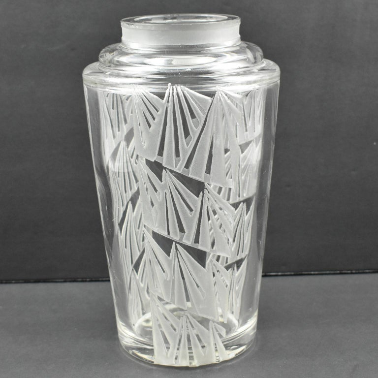 Handsome 1930s acid etched glass vase by French designer Jean Luce (1895-1964). Geometric design with repeated decoration all around the vase. Signature underside with the usual artist's monogram. 
(dots underside are protection rubber