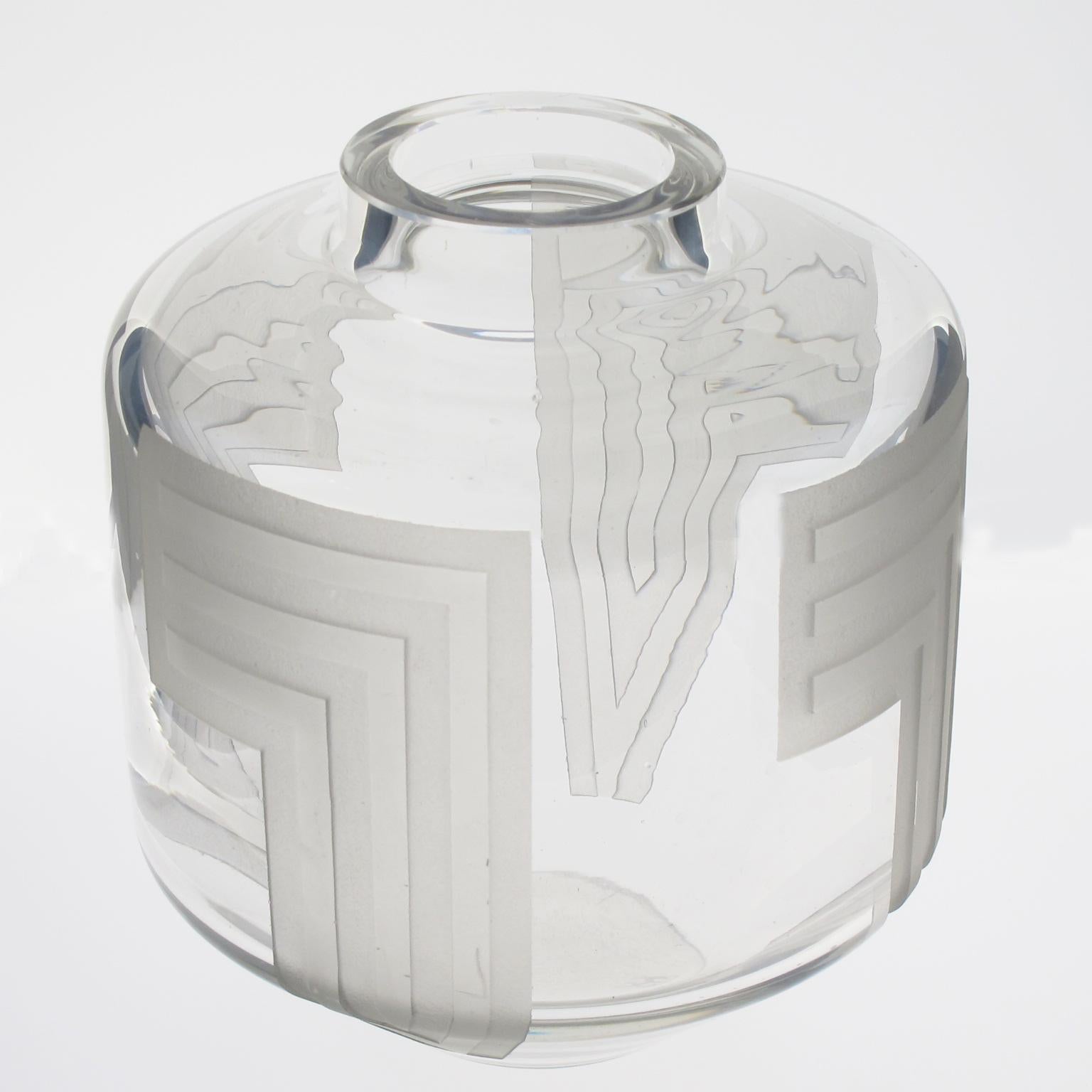 French designer Jean Luce (1895-1964) created this impressive 1930s acid-etched glass vase. The geometric design with repeated decoration is all around the vase. The artist's signature is underside with the usual known monogram. 
The vase is in good