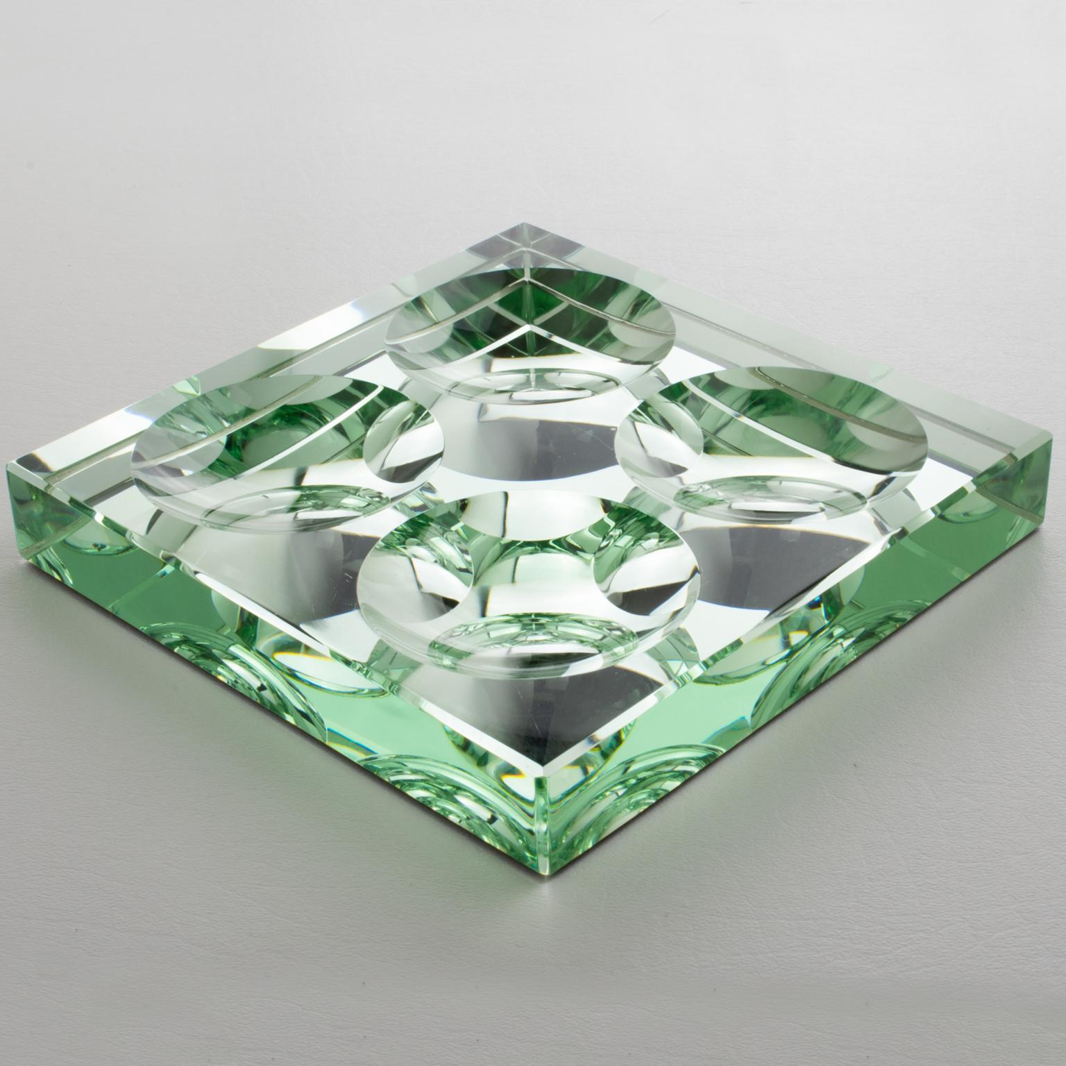 French designer Jean Luce (1895 - 1964) created this stunning French Art Deco mirrored glass desk tidy, vide poche or decorative centerpiece. This catchall features an extra thick transparent glass slab with a mirror finish underside. The design