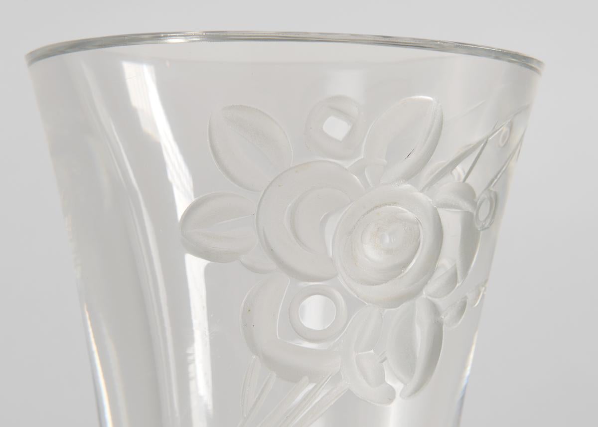 This elegant Art Deco clear glass vase is carved with a floral bouquet. Monogrammed.