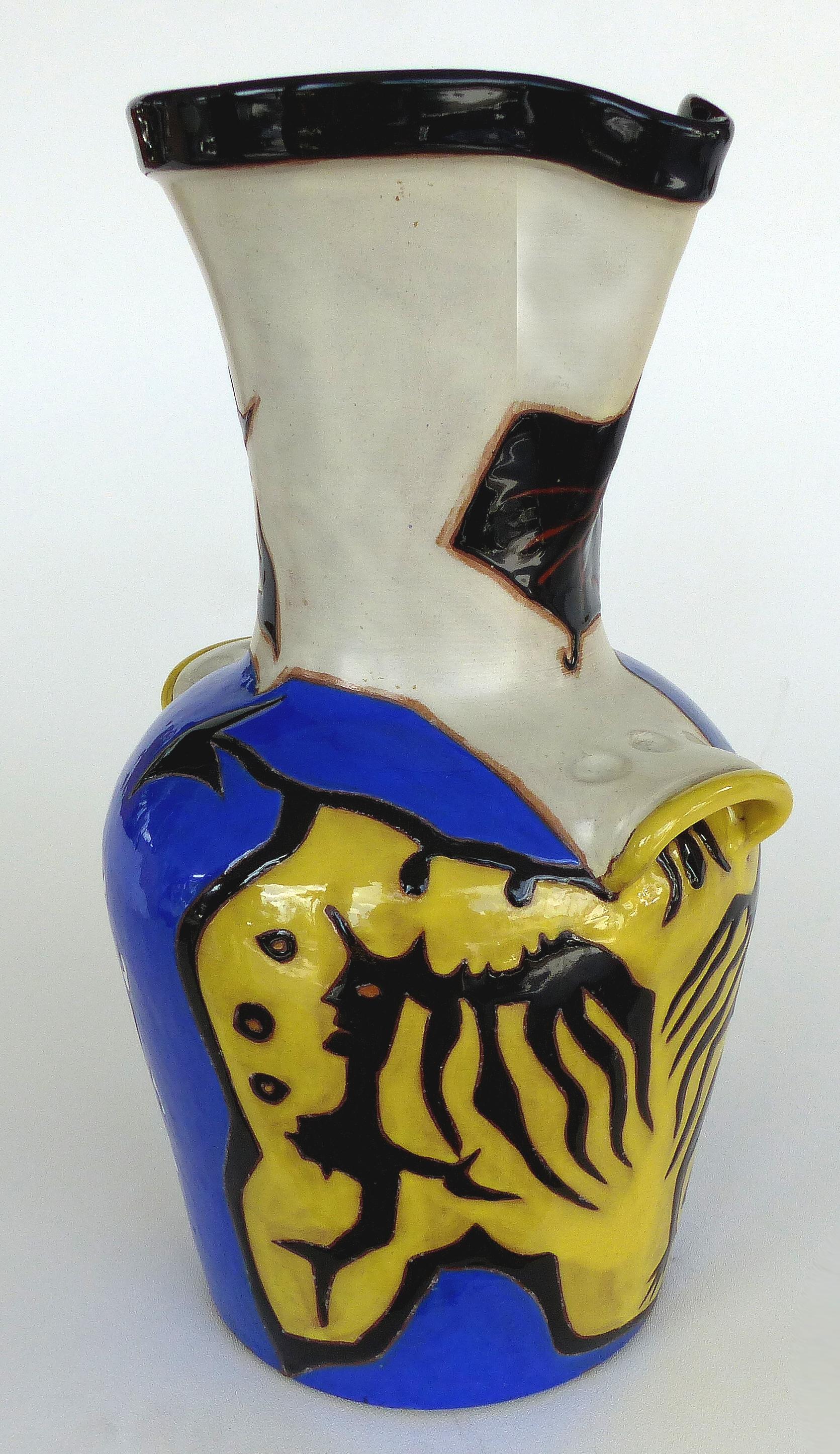 Jean Lurçat French ceramic midcentury vase 22/50

Offered for sale is a limited edition number 22 from an edition of 50 French ceramic two-handled vase by artist Jean Lurçat (1892-1966). This figural vase depicts stylized faces and figures. This