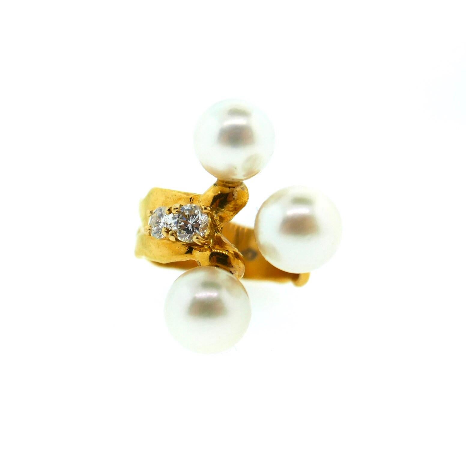 Jean Mahie 22 Karat Yellow Gold Akoya Pearl Diamond Ring

This is a very unique Jean Mahie ring as it features his classic abstract design with diamonds and akoya pearls. The diamonds are of excellent quality and total approximately .25 carats in